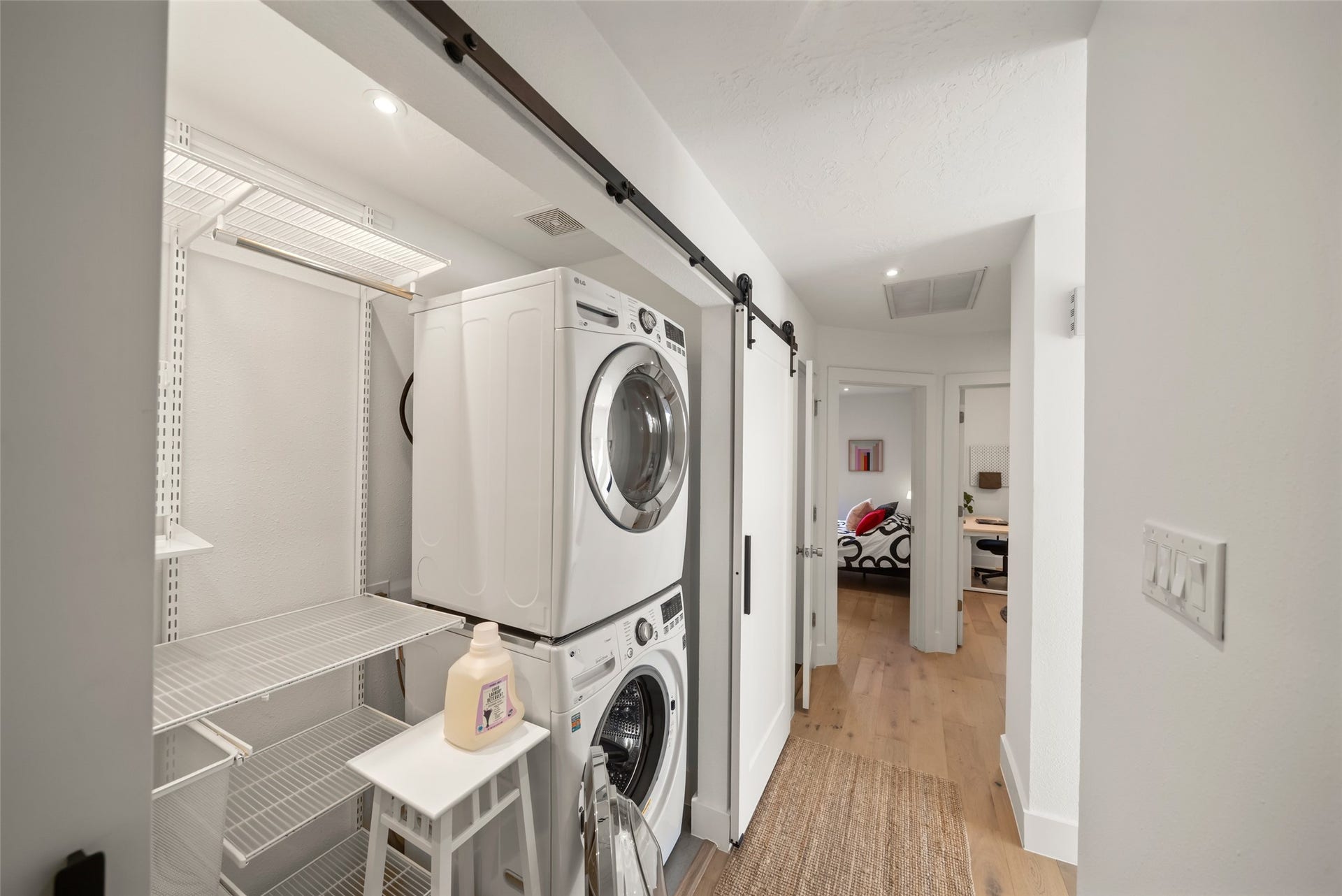 258 Sentry Maple Place, The Woodlands, TX 77382 The second story laundry area has been finished with customer elfa shevling to maxize storage and efficiency.