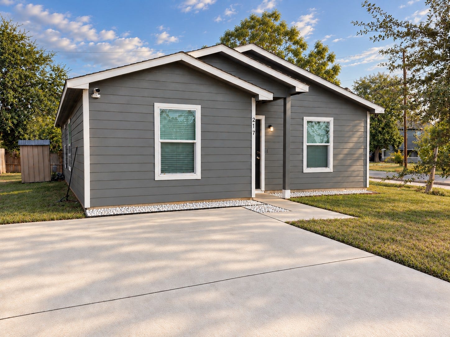 Welcome to 217 Gans St, this view highlights the homes modern profile, driveway, and welcoming approach.