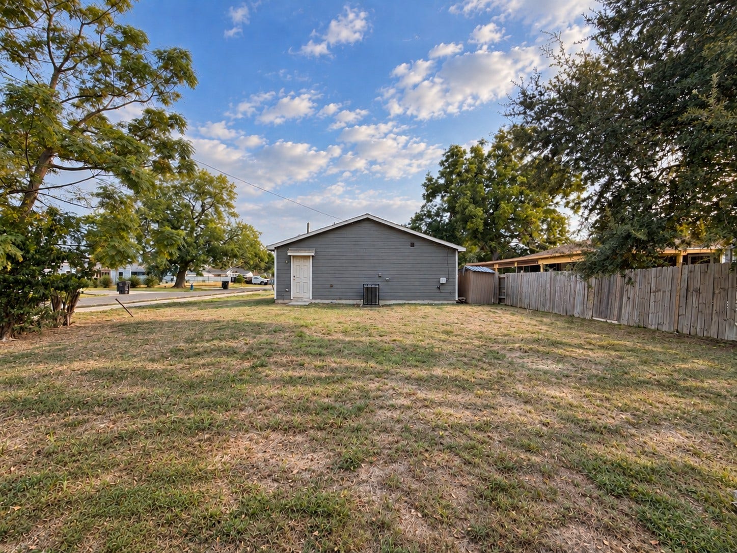 Spacious backyard offering plenty of room for outdoor entertaining, play, or future possibilities.