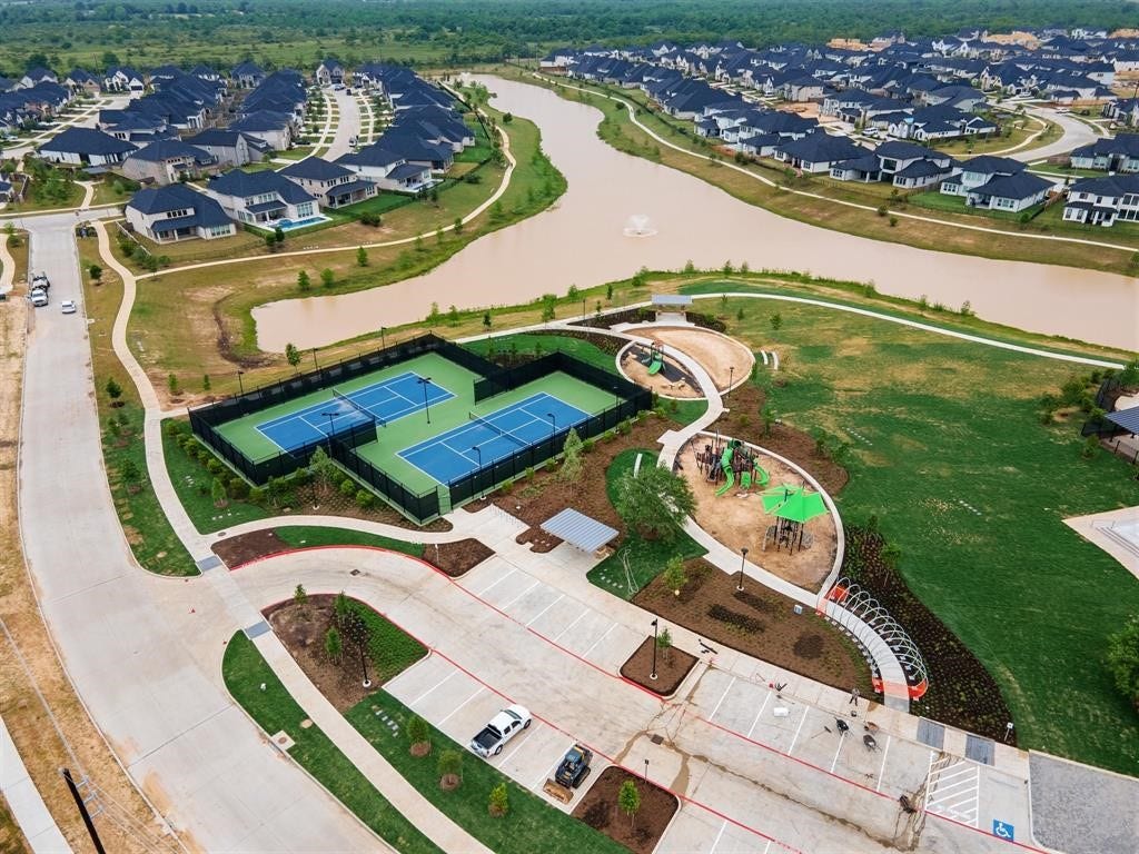 29651 Bur Creek Lane, Fulshear, TX 77441 Out of the multiple community Amenity Center's of Cross Creek Ranch this amenity center - THE LANDING is equipped with fitness center, tennis courts and swimming pool and a splash pad. The center is walking distance from the house.
