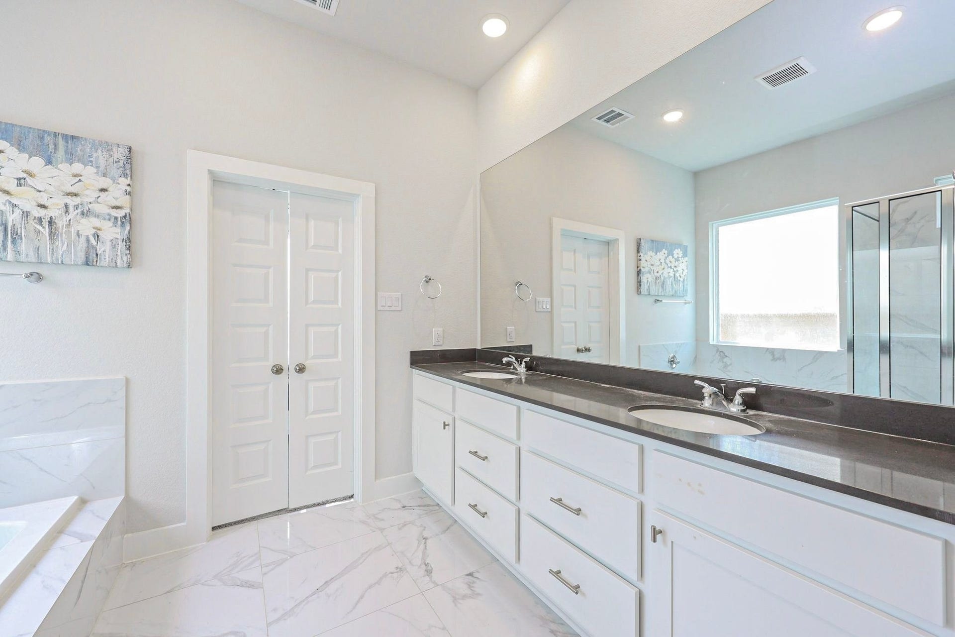 29651 Bur Creek Lane, Fulshear, TX 77441 Luxurious primary bathroom with dual sinks, elegant marble flooring, and a spacious glass-enclosed shower.
