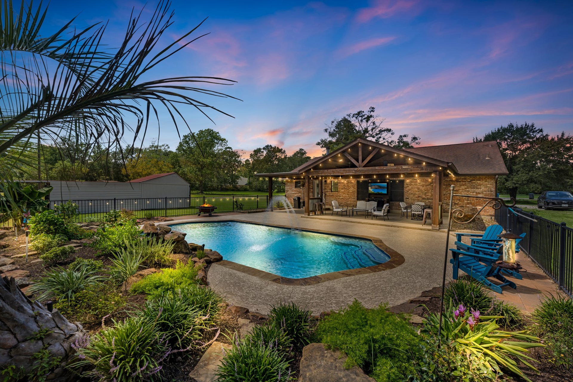 22698 Brook Forest Road, New Caney, TX 77357 Private backyard retreat on 1.5 acres with sparkling pool, water features & lush landscaping!
