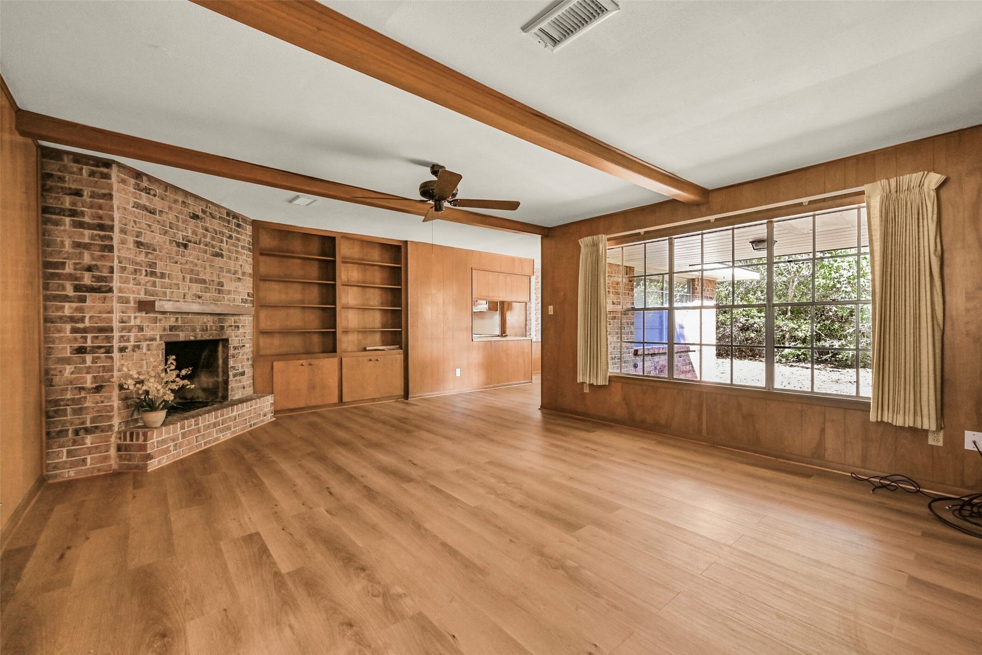 2101 Willow Dell Drive, Seabrook, TX 77586 Cozy den with luxury vinyl plank flooring and a gas fireplace