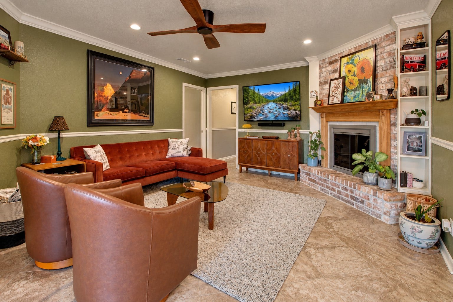12315 Thaman Drive, Dickinson, TX 77539 This living room features great natural light, a wood burning fireplace, and built in shelving.