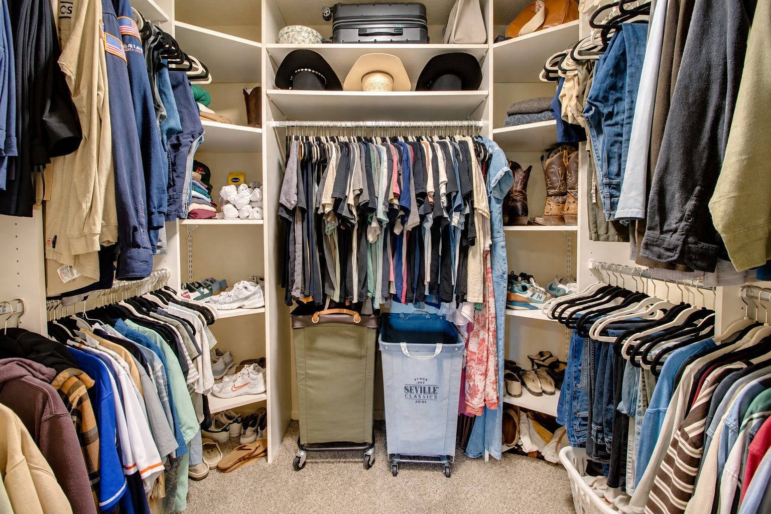 12315 Thaman Drive, Dickinson, TX 77539 This primary bedroom closet just adds to the storage that is already abundant in this home!
