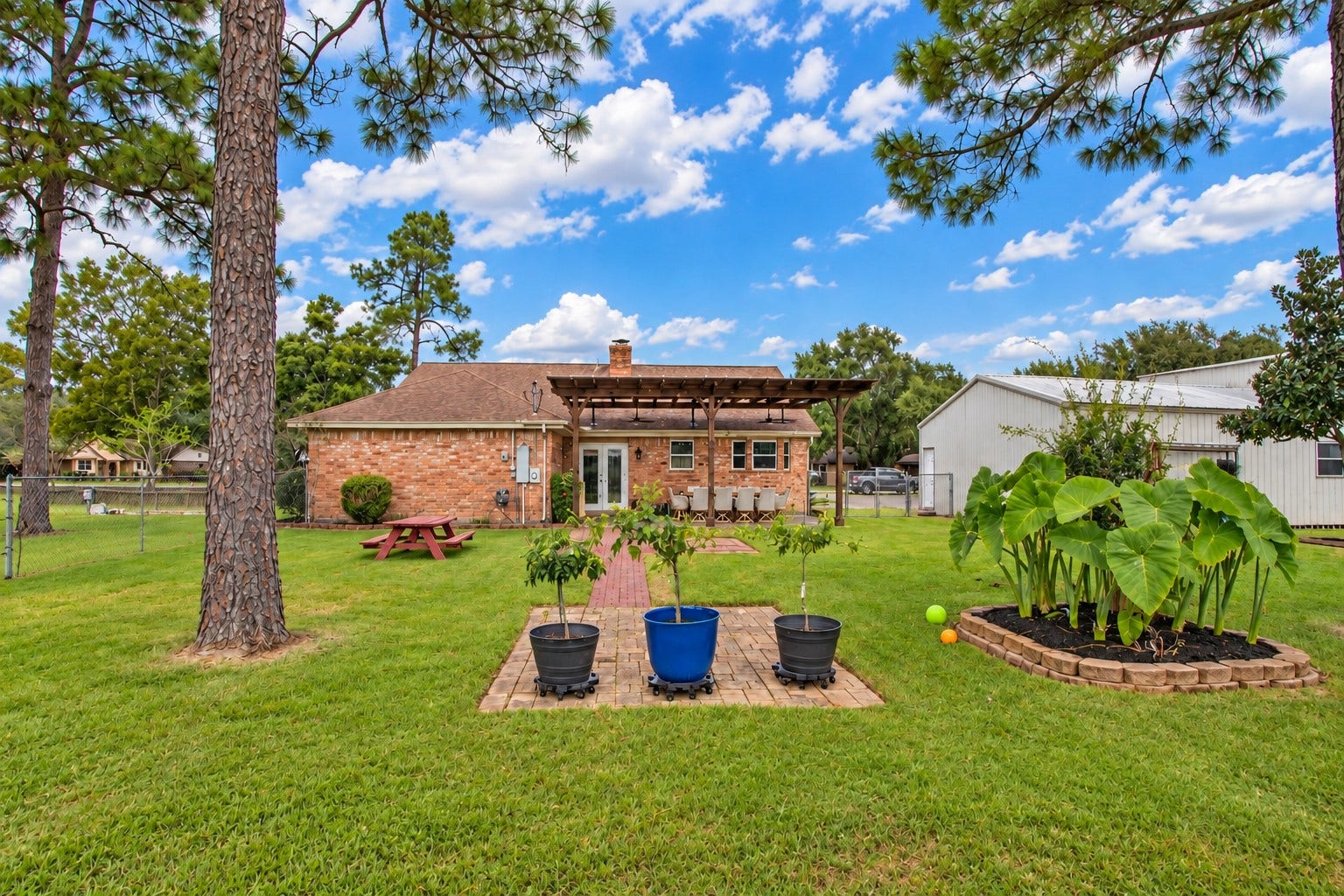 12315 Thaman Drive, Dickinson, TX 77539 The spacious backyard surrounded by mature pine trees, with plenty of room to relax, garden... whatever your heart desires!