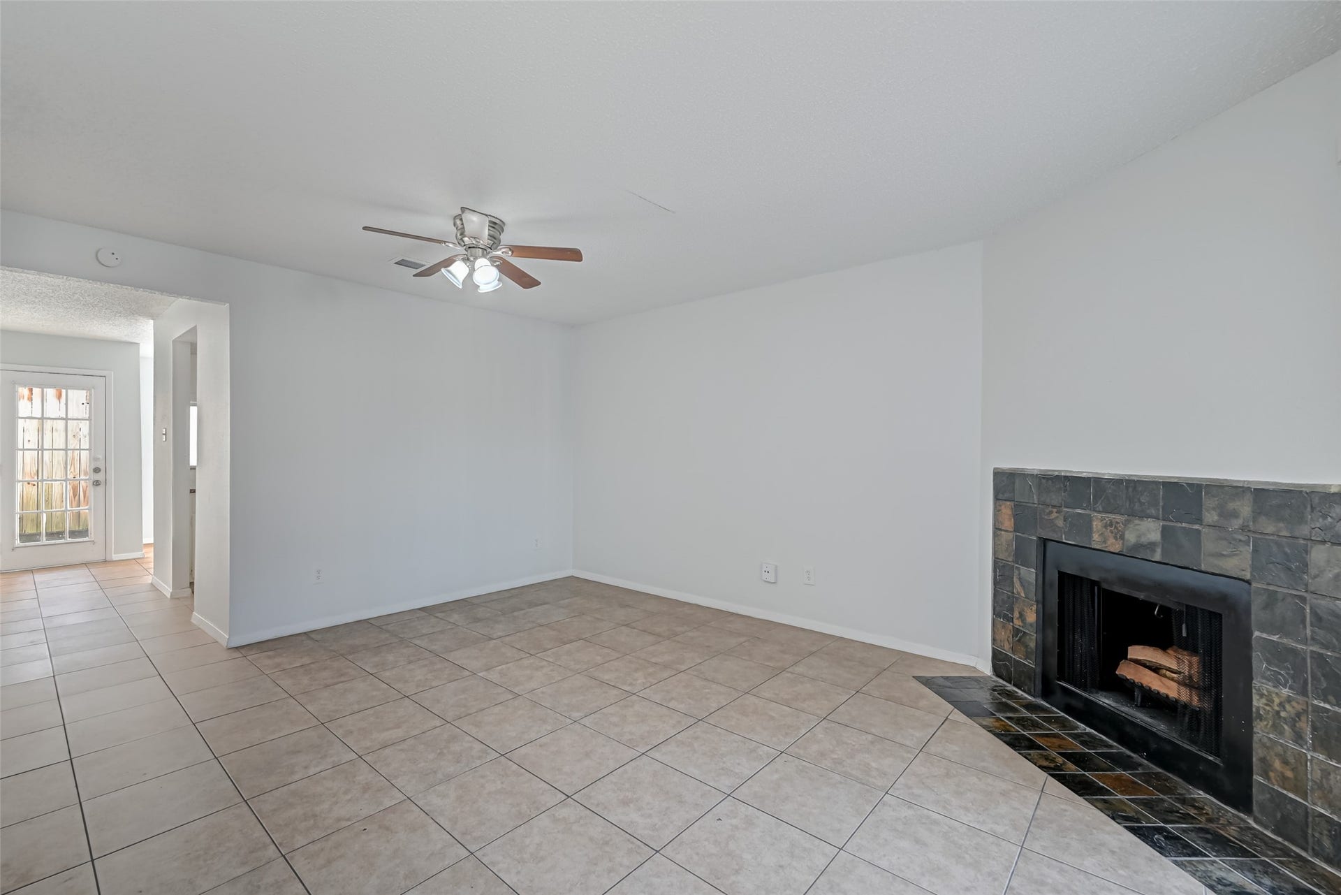 Living room with entry to kitchen and breakfast nook