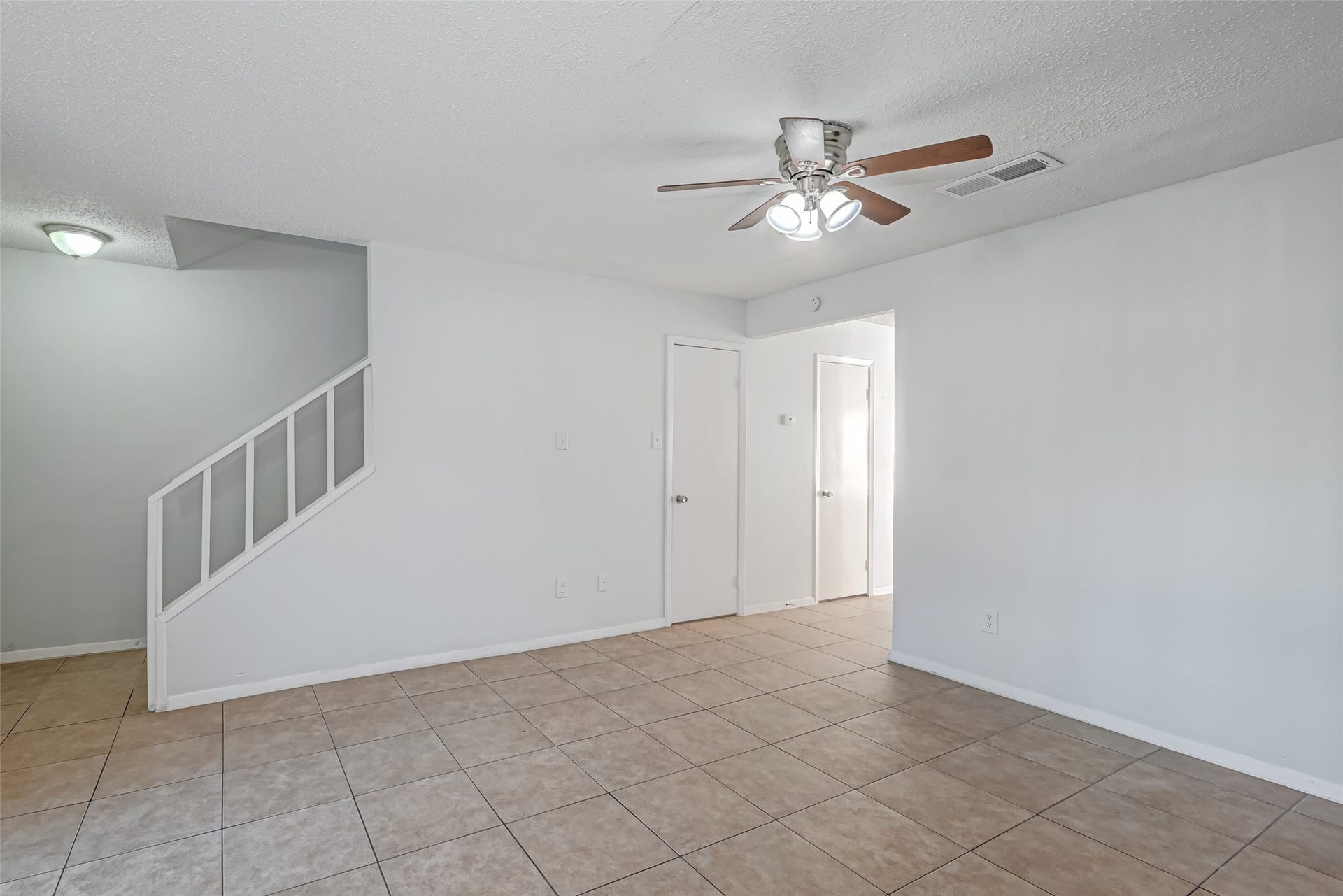 Living room with storage underneath the stairs