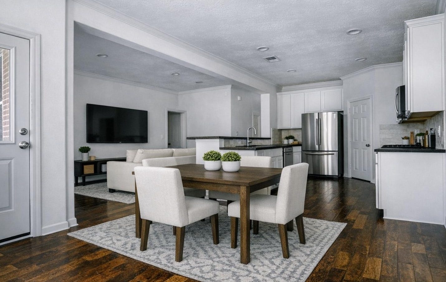 AI Staged photo of open-concept
dining, kitchen and living room
with lots of windows the face the
resort-style pool and keep the
home full of light.