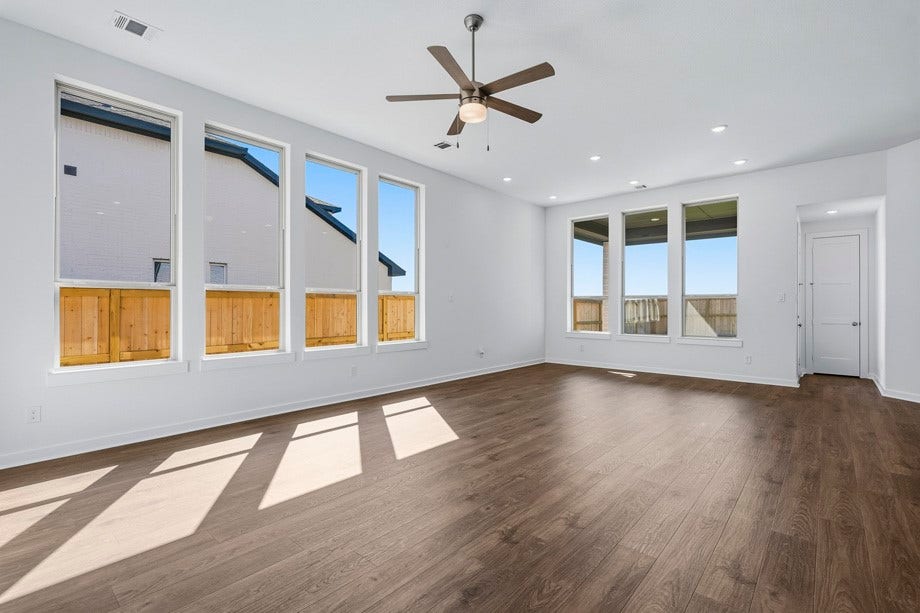 6430 Mahogany Branch Trail, Manvel, TX 77578 Dining is open to family room with tons of windows for natural light.