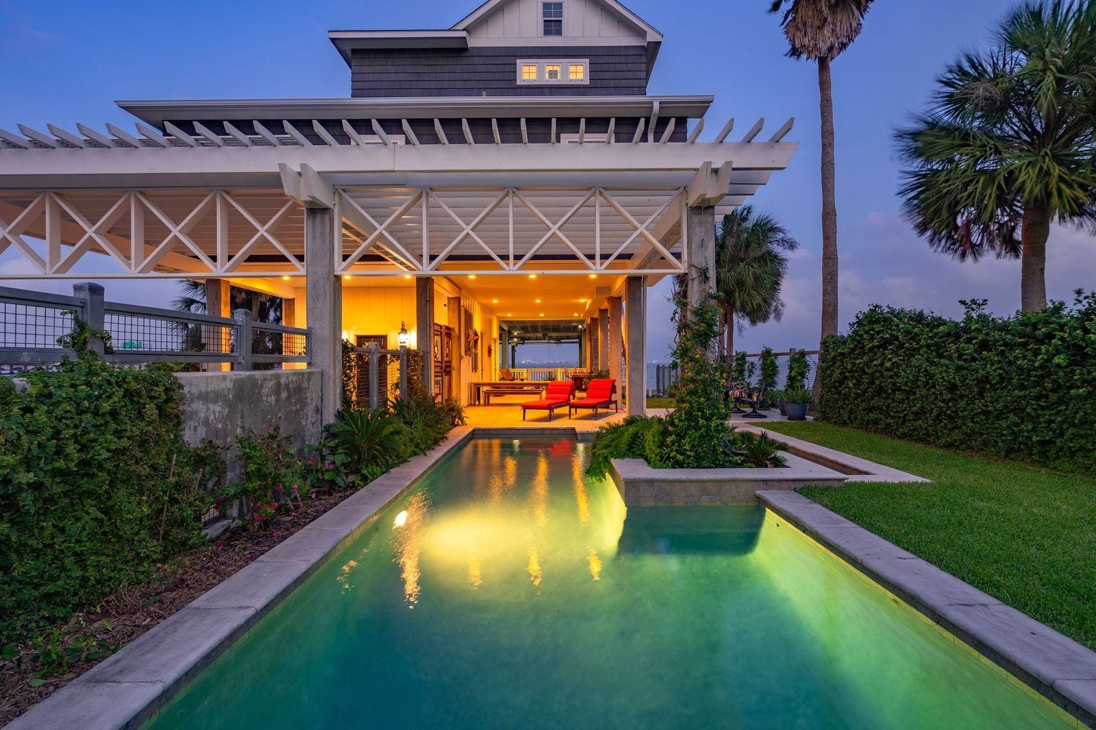 12 Tiki Circle, Tiki Island, TX 77554 Enjoy Resort Style Living All Year with Heated Swimming Pool!