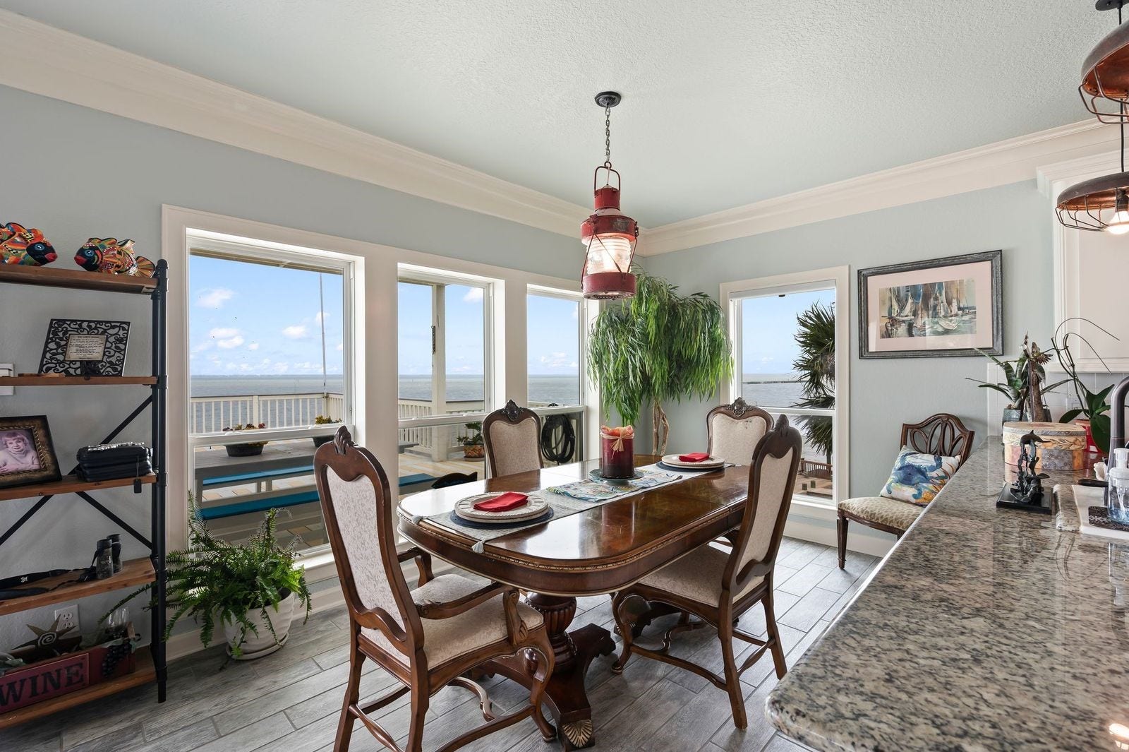 12 Tiki Circle, Tiki Island, TX 77554 Entertain in Style While Enjoying Breathtaking Views! Designated dining area is perfect for entertaining friends and family.