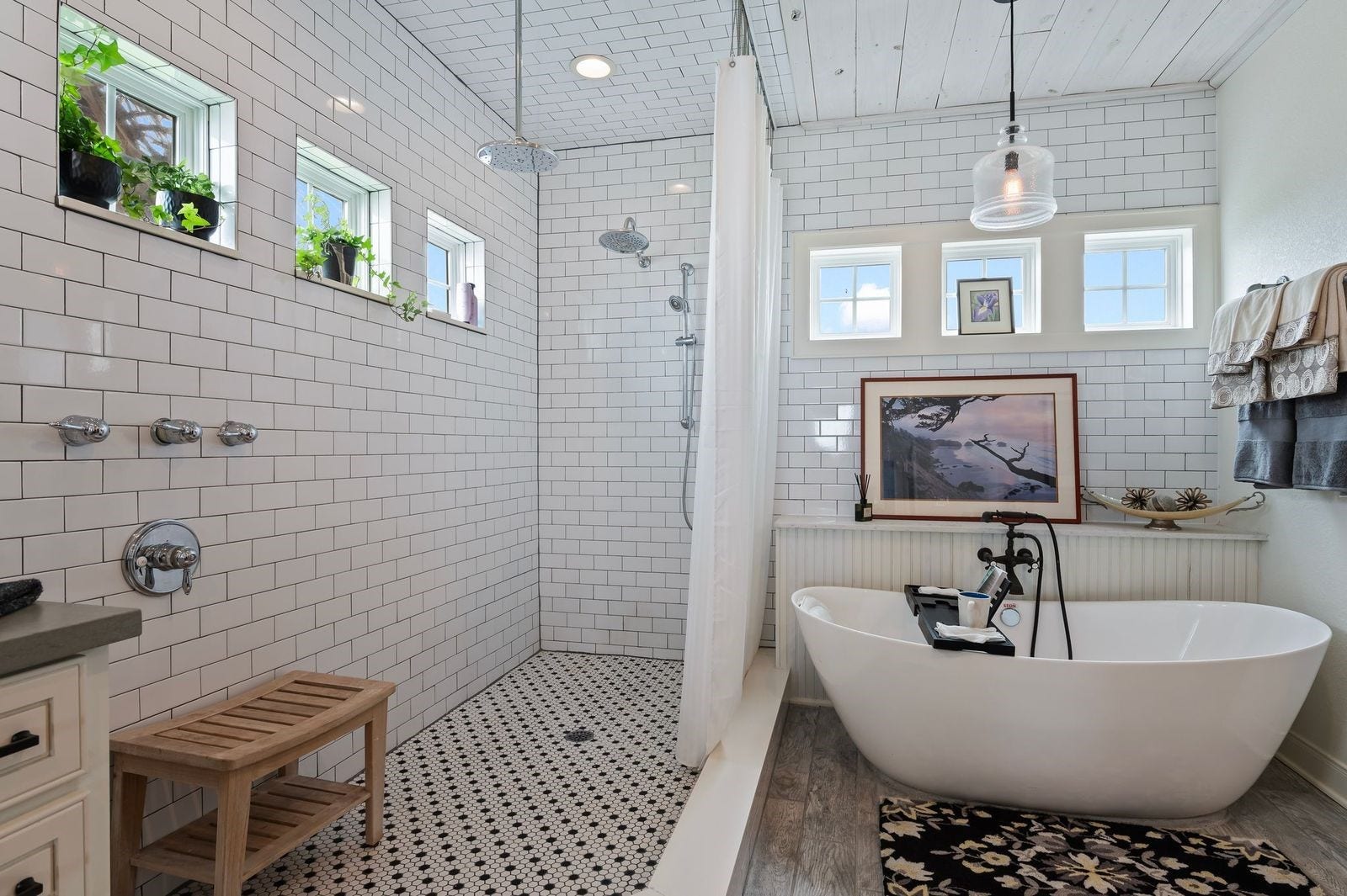 12 Tiki Circle, Tiki Island, TX 77554 Beautiful, Modern & Spacious! Oversized custom walk-in shower with multiple body spray features and designer subway tile surrounding, or relax in the custom deep-soaking bathtub with upscale faucet.