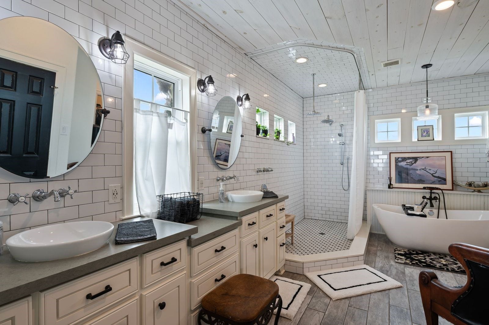 12 Tiki Circle, Tiki Island, TX 77554 Classic Meets Contemporary! The amazing primary bathroom has it all - double sinks, vanity area, oversized updated shower and relaxing soaking tub.