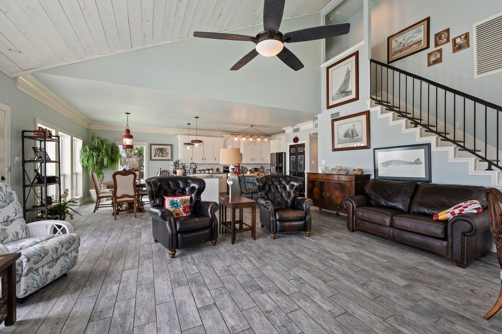 12 Tiki Circle, Tiki Island, TX 77554 Stylish, Contemporary, Coastal Home! Large living space and open concept design with soaring cedar plank ceilings and cool coastal colors.