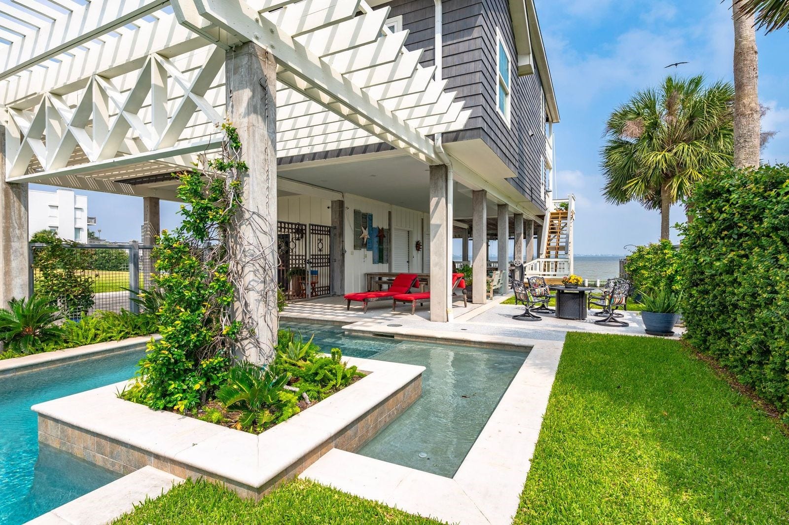12 Tiki Circle, Tiki Island, TX 77554 Purchase A Lifestyle Not Just A Home! Plunge into Summer 2026!