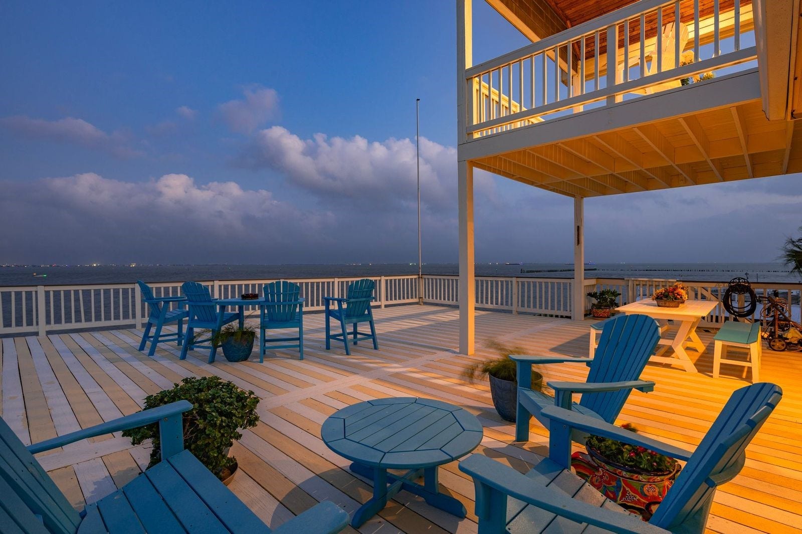 12 Tiki Circle, Tiki Island, TX 77554 Designed with entertaining in mind, the extended outdoor patio and upper deck provide breathtaking views of Galveston Bay.