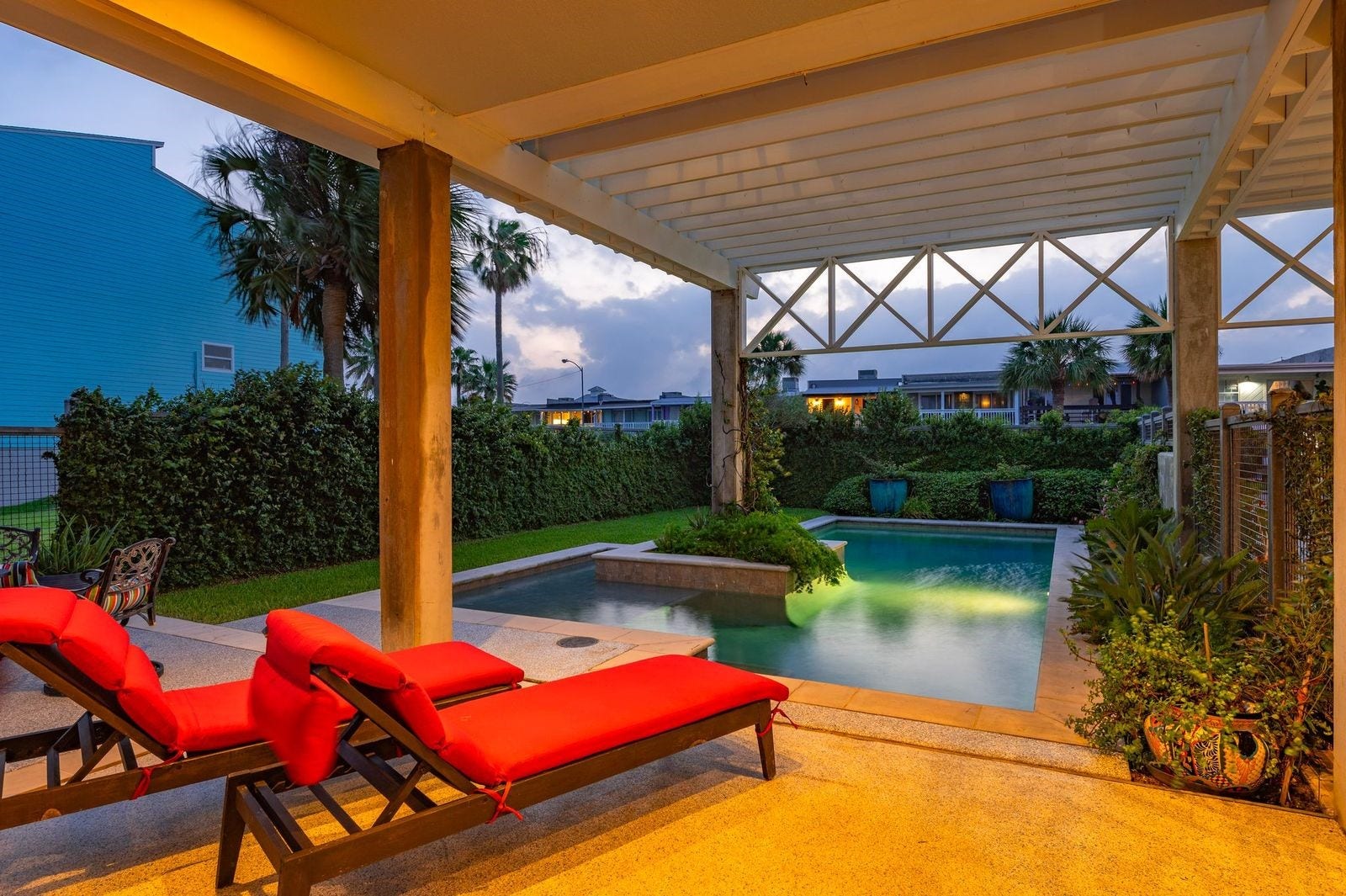12 Tiki Circle, Tiki Island, TX 77554 Private Pool with Tranquil Setting! Fenced yard with extensive decking, covered patio and exterior lighting.
