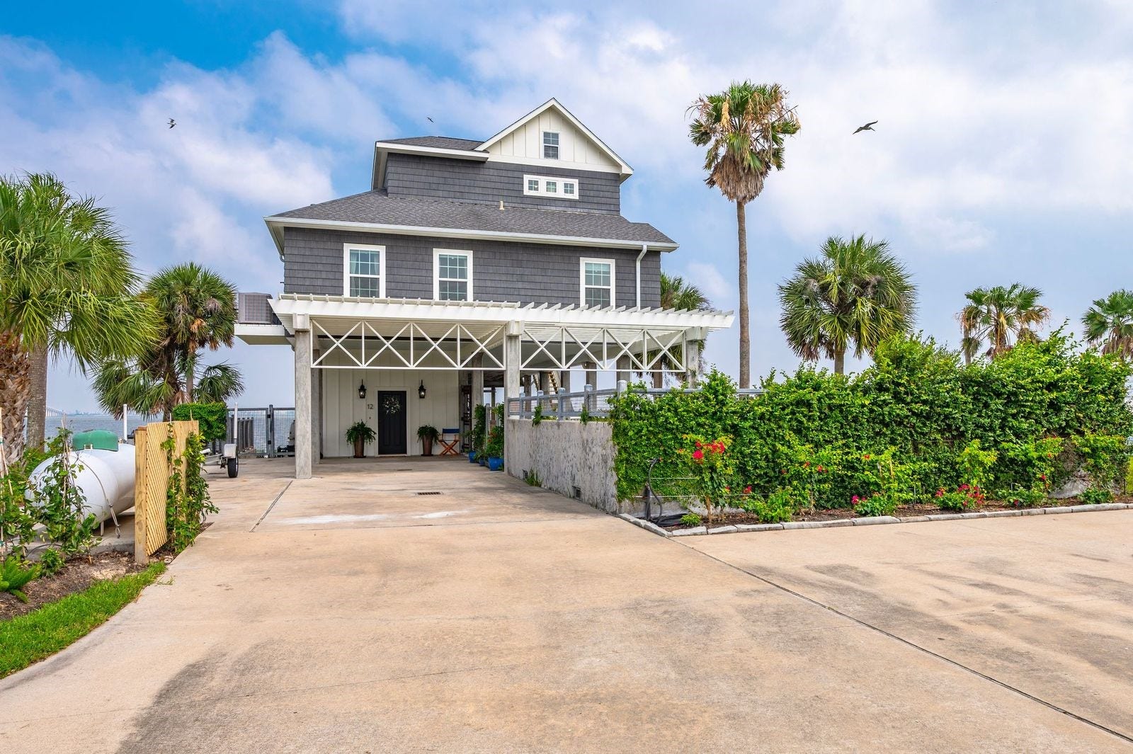 12 Tiki Circle, Tiki Island, TX 77554 The Perfect Package Of Space, Style and Comfort! Exterior boasts of Nichiha fiber cement siding. Nichiha gives builders the freedom to create stunning spaces that align with modern design trends and sustainability goals.