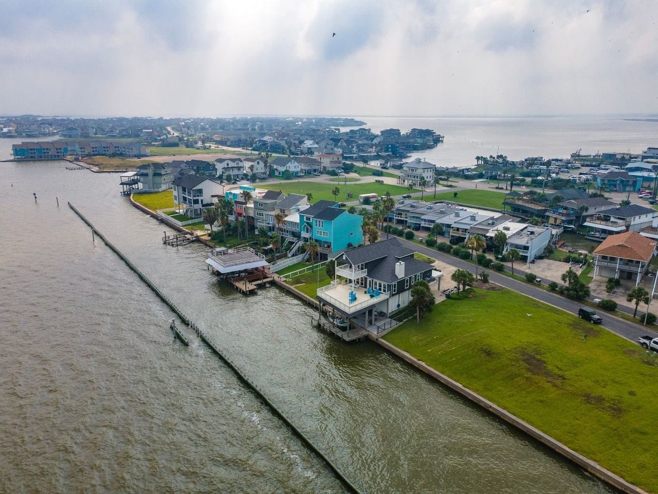 12 Tiki Circle, Tiki Island, TX 77554 Waterfront Haven Overlooking Galveston Bay! Bird's eye view of Tiki Island and Galveston Bay