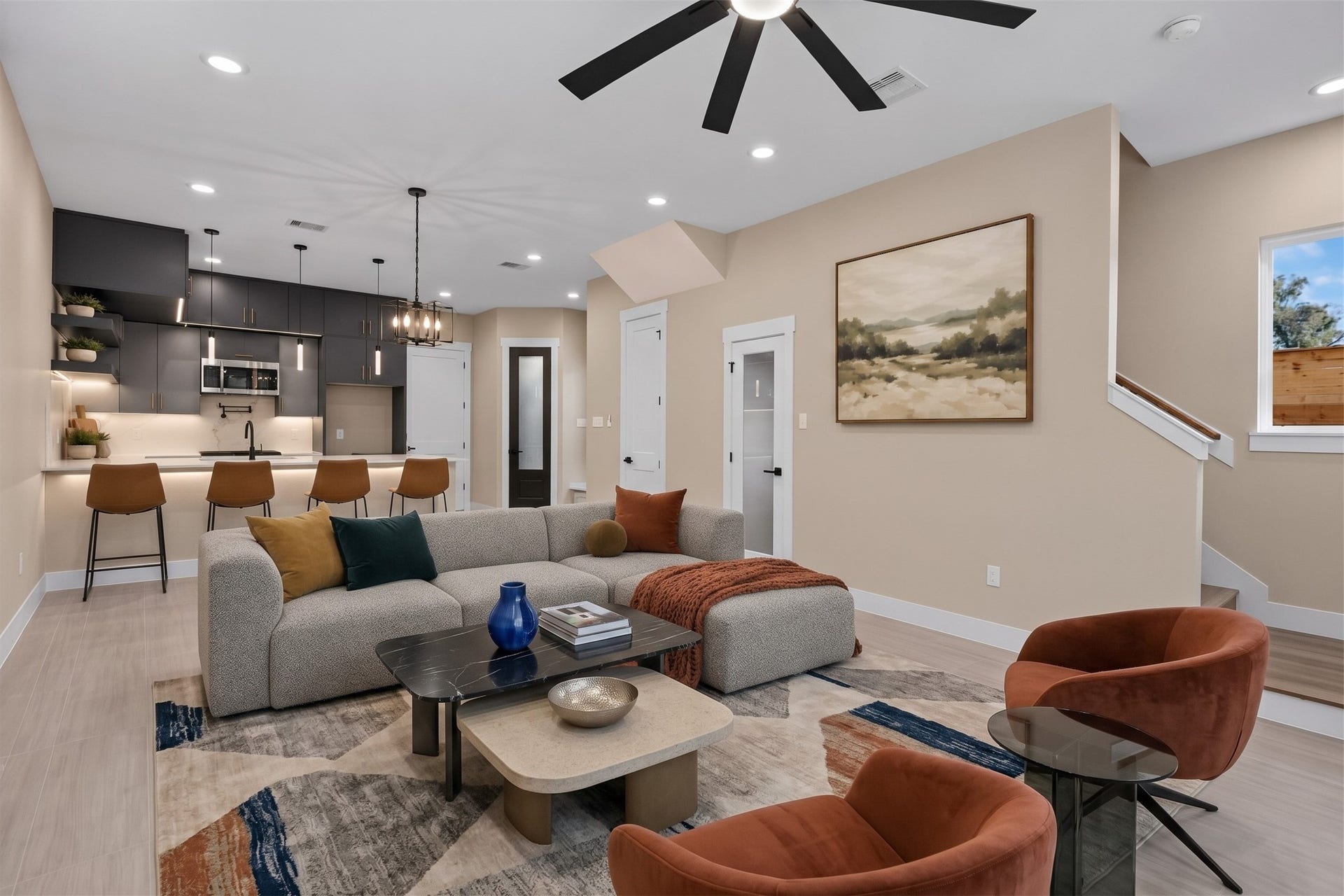 Virtually Staged: The expansive layout offers smooth traffic flow between living zones, making it an inviting centerpiece of the home.