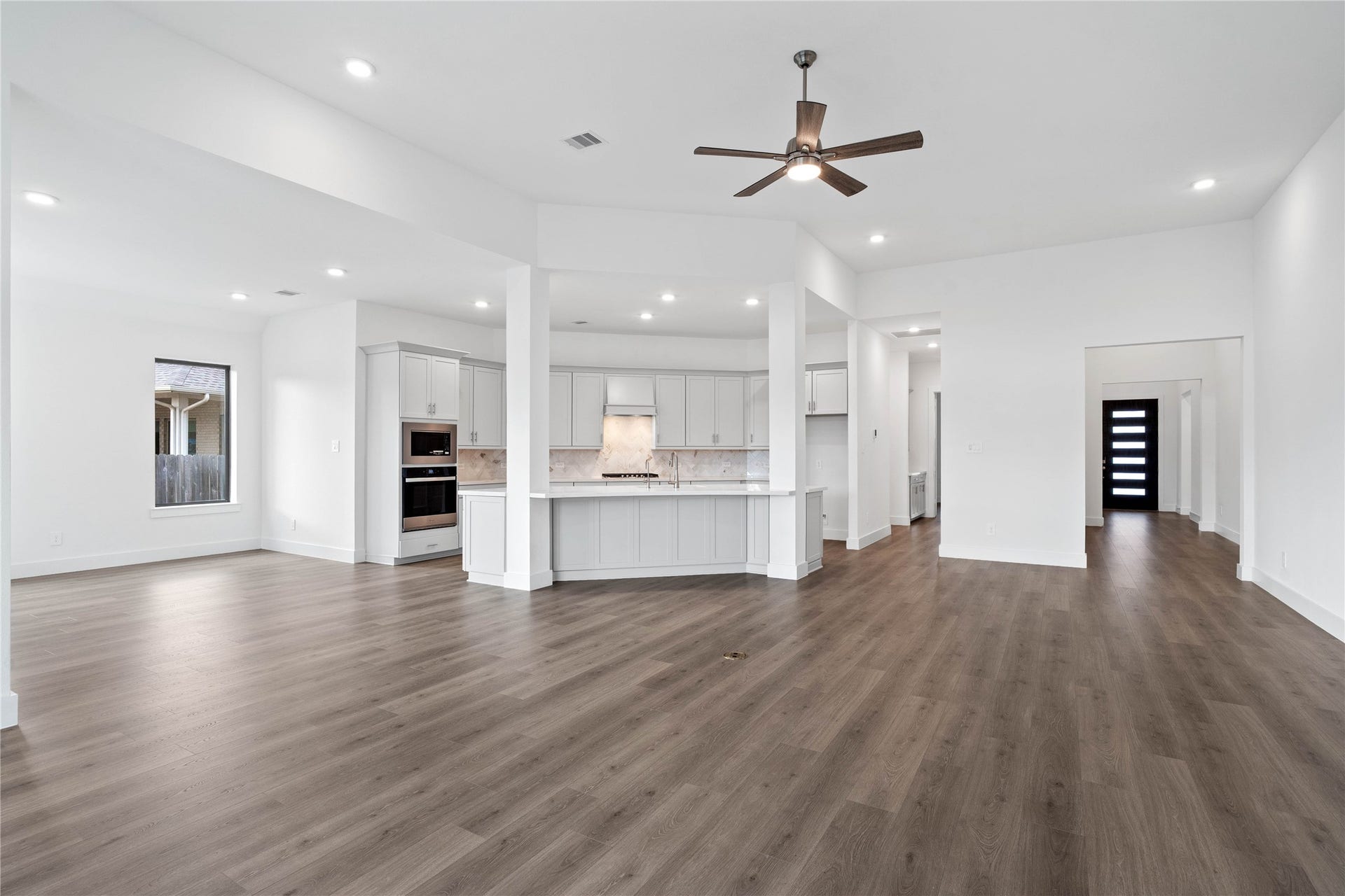 Whether you are relaxing in the great room or greeting guests at the front door, the open sightlines ensure that everyone feels connected, fostering a truly inclusive living experience where isolation is a thing of the past.