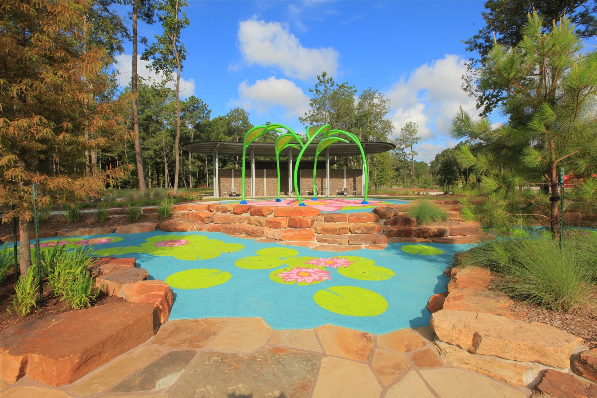 The splash pad is a feature in ARTAVIA as well as the playground with a climbing structure, and extensive wooded trails.