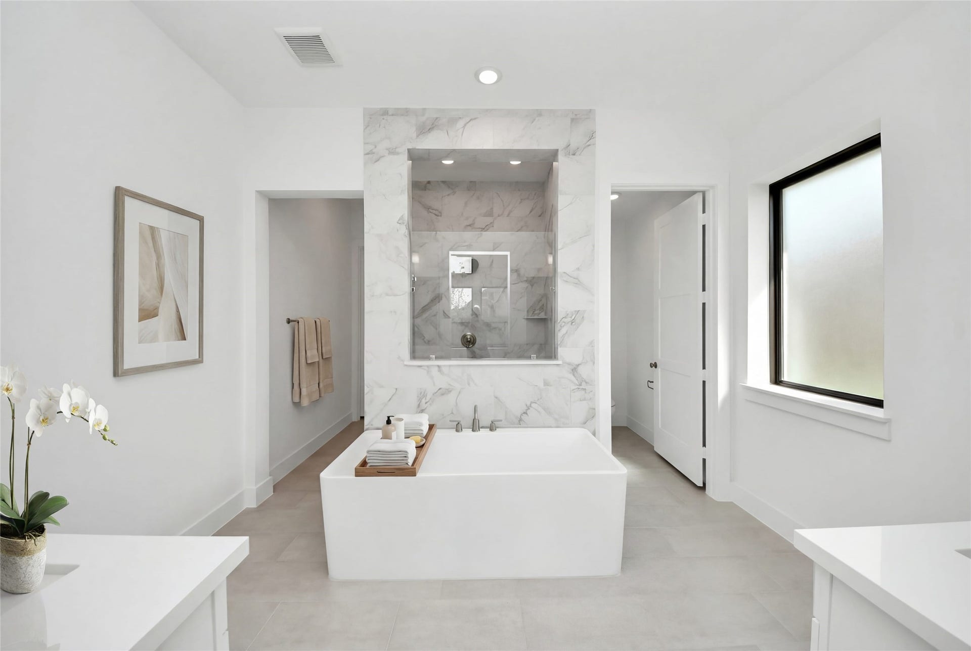The centerpiece of this contemporary primary bath is the deep, freestanding bathtub, offering an ideal spot for relaxation with a unique view into the walk-in shower.