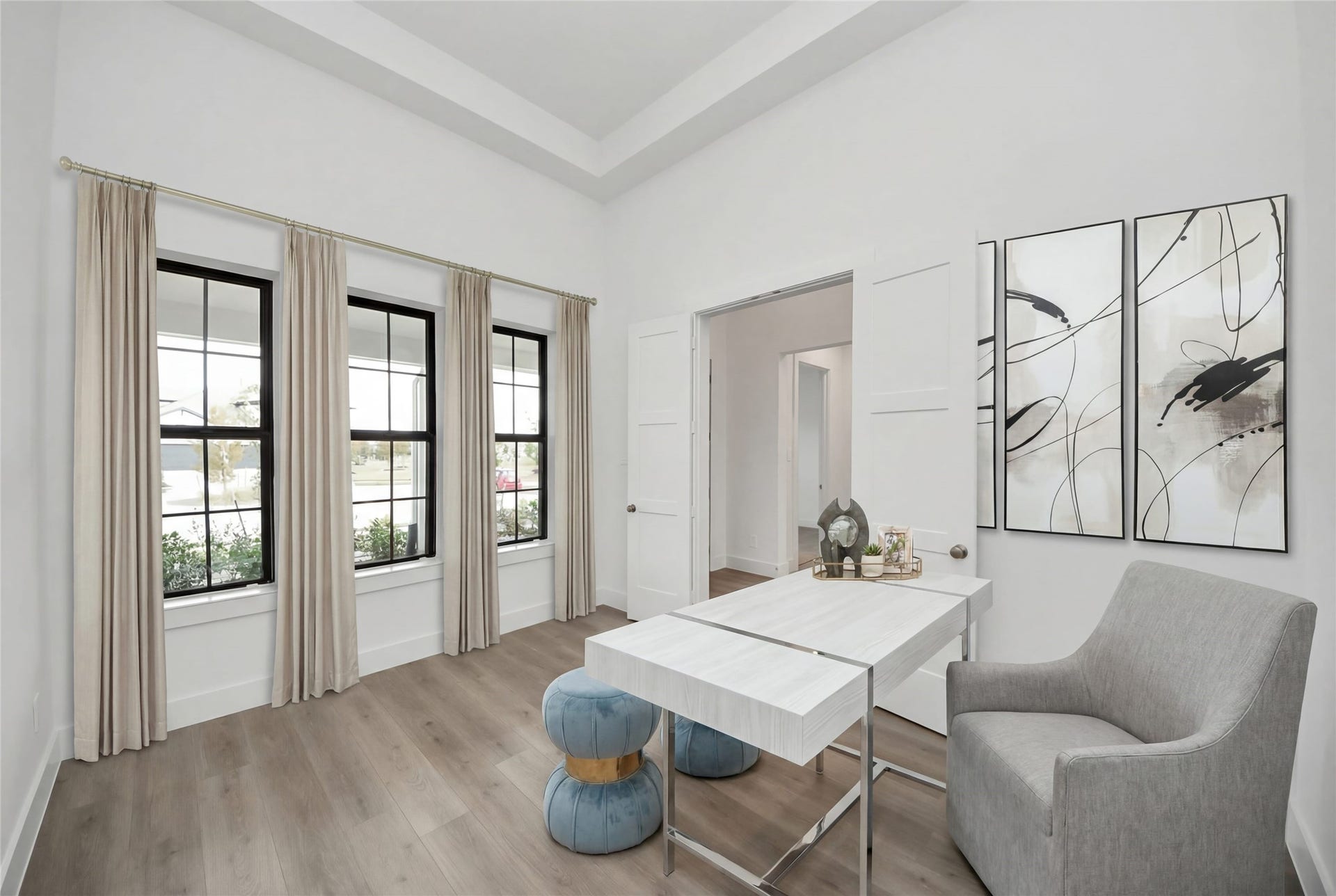This handsome Study features laminate flooring, large windows, tray ceiling, lighting, custom paint, and double doors for privacy.
