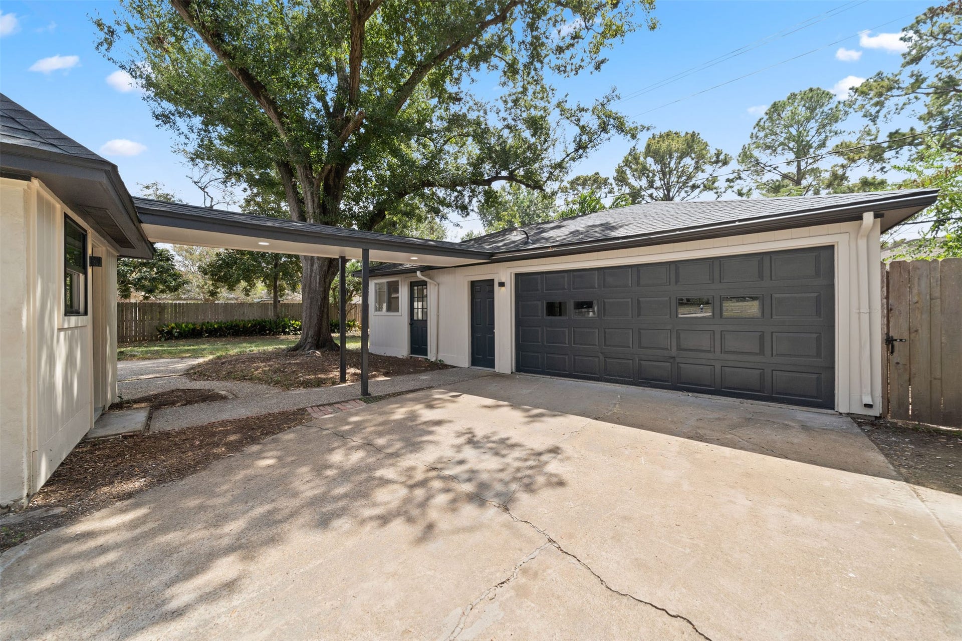 10111 Kerrwood Lane, Houston, TX 77080 The detached garage features a covered walkway for convenient access to the home.