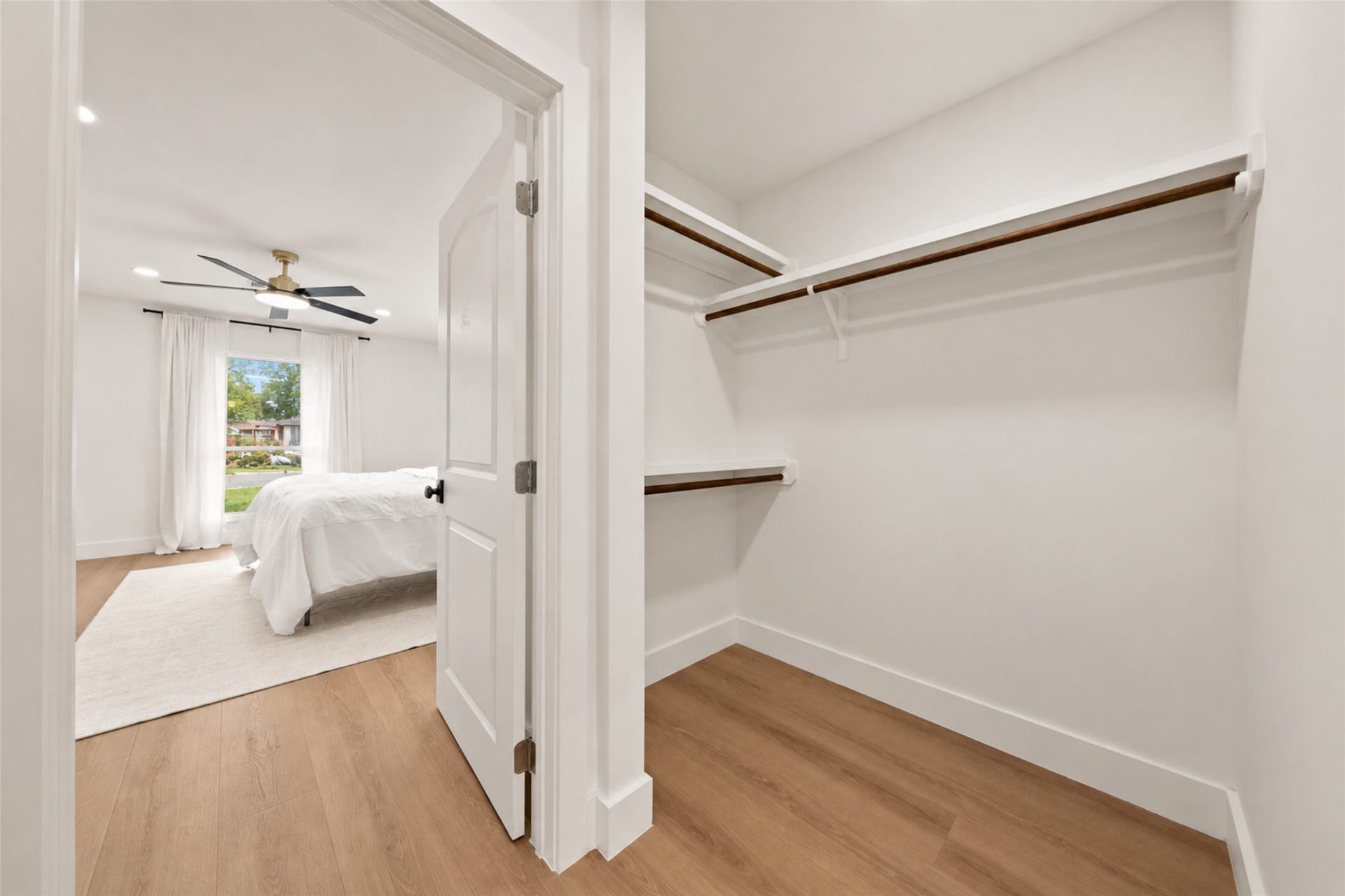 10111 Kerrwood Lane, Houston, TX 77080 The primary suite features separate his-and-hers walk-in closets, offering built in storage and shelving for convenient organization.