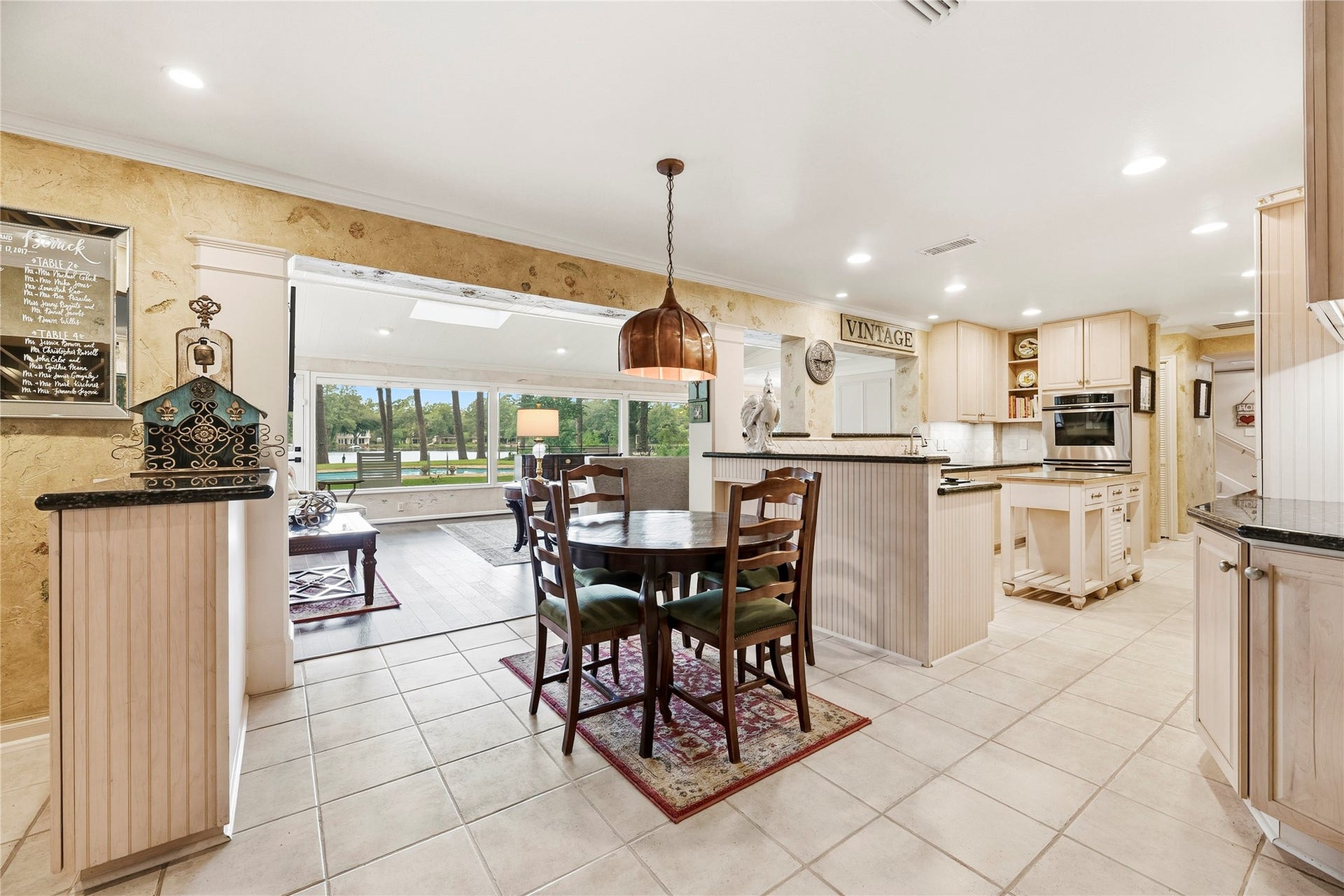 13131 Holston Hills Drive, Houston, TX 77069 Picturesque lakefront views from the breakfast nook complete with an antique light fixture.