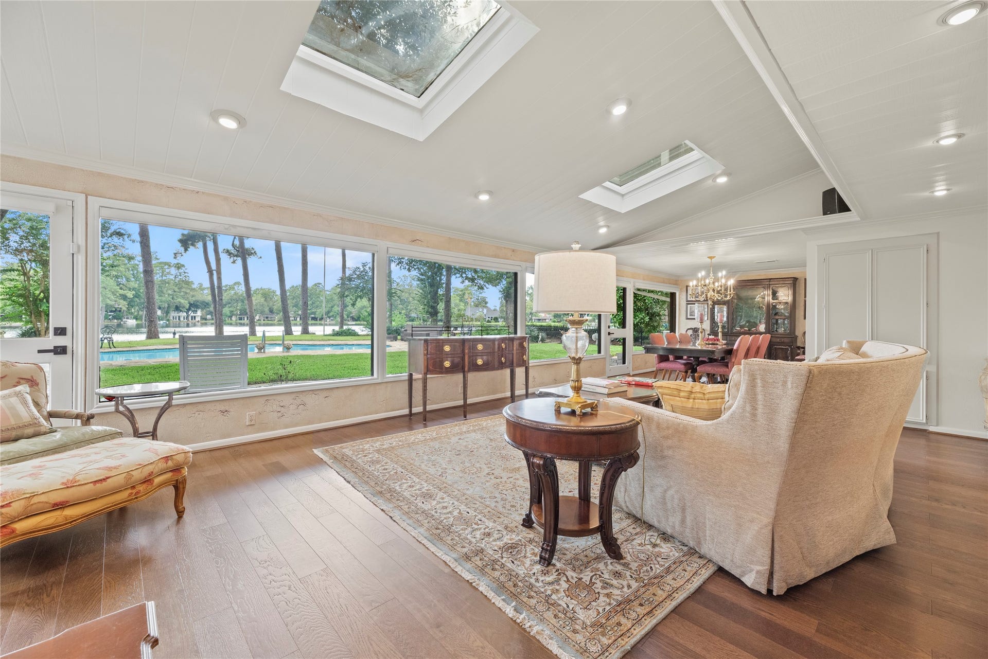 13131 Holston Hills Drive, Houston, TX 77069 Heart of the home with a wall of windows, beautiful wood floors, sky lights, and recessed lights.