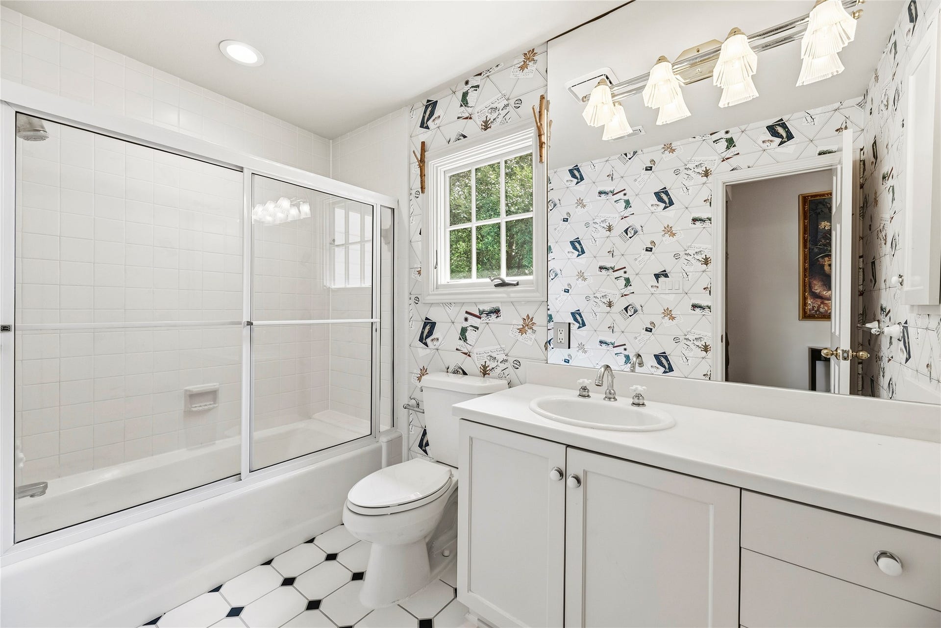 13131 Holston Hills Drive, Houston, TX 77069 Secondary bathroom with a shower/tub combo + vanity.