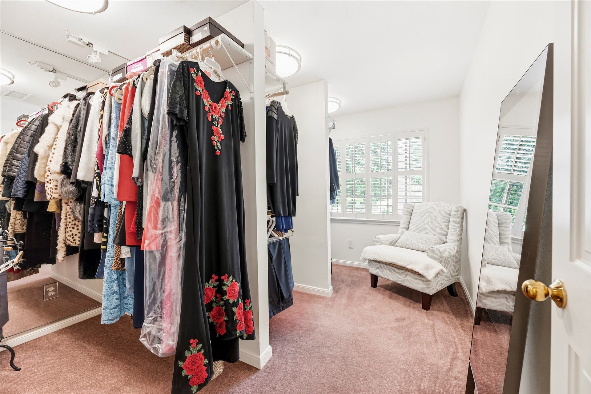 13131 Holston Hills Drive, Houston, TX 77069 Bedroom #4 upstairs (has been utilized as a closet/dressing room) complete with plush carpet, a closet, and large windows for natural light.
