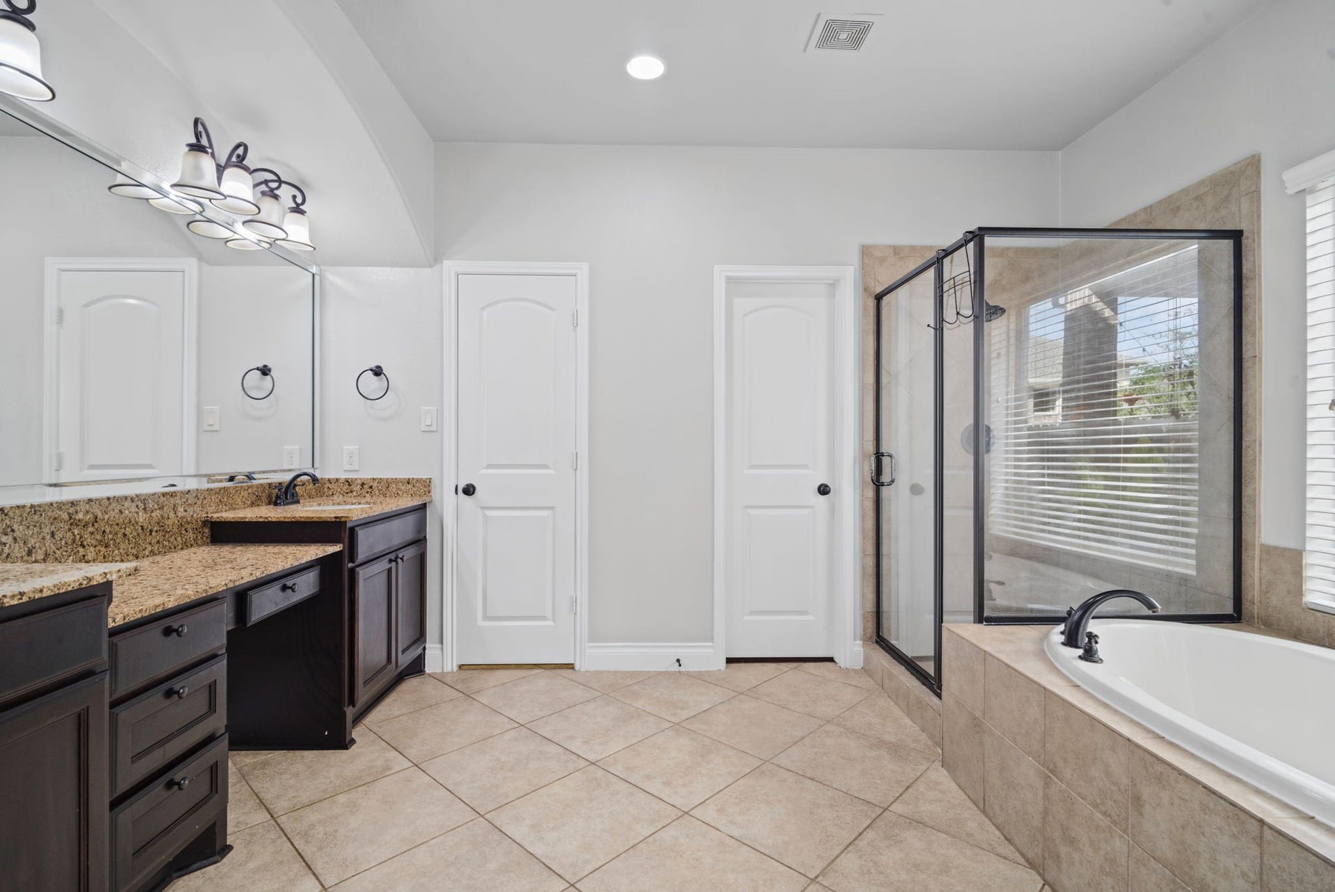 9819 St Romain Drive, Katy, TX 77494 Primary bathroom with dual closets.