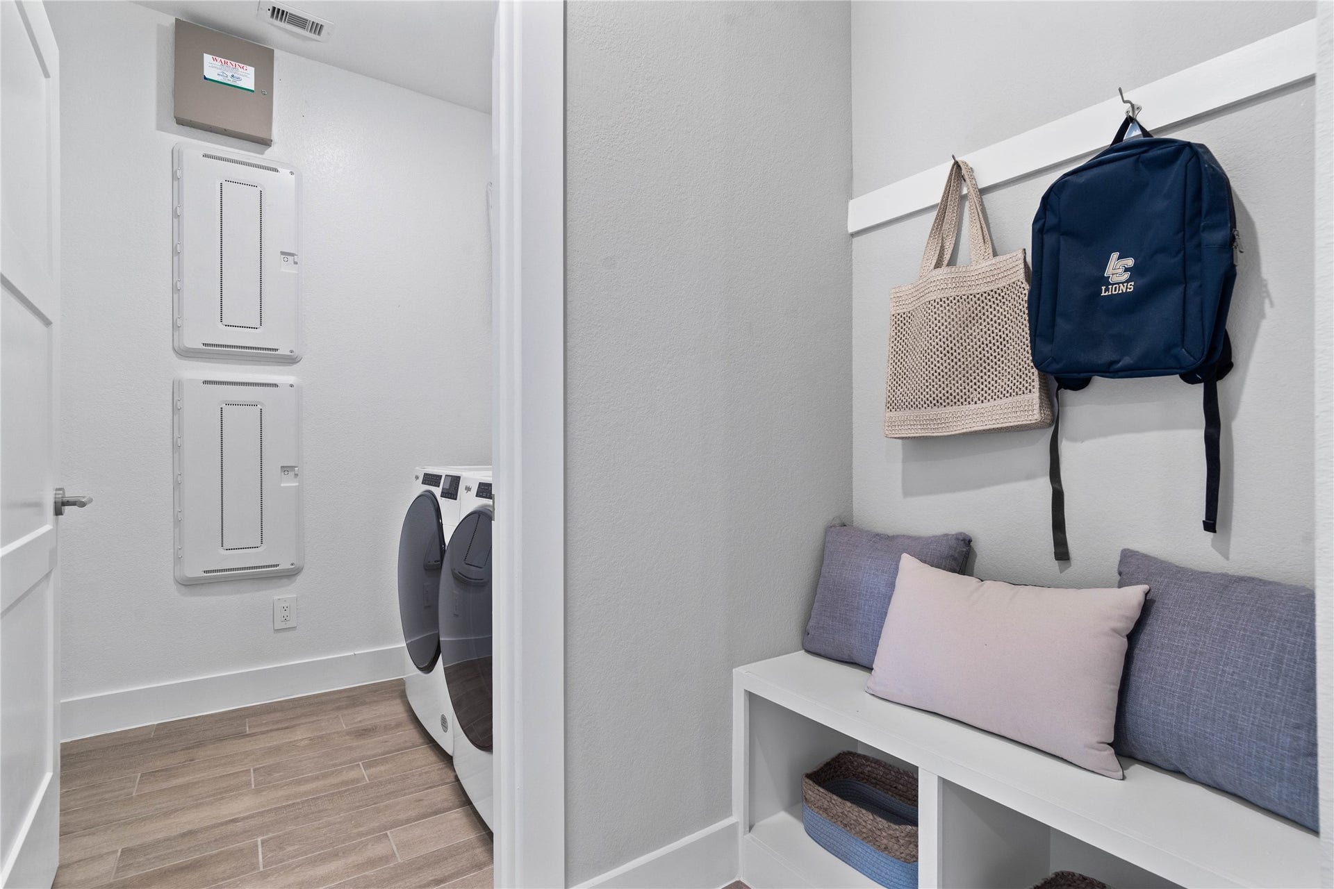 19608 Montgomery Ridge Way, Montgomery, TX 77316 This dedicated area features a custom built-in bench with hooks, perfect for organizing coats, bags, and shoes right off the main hallway, keeping the rest of the home tidy.