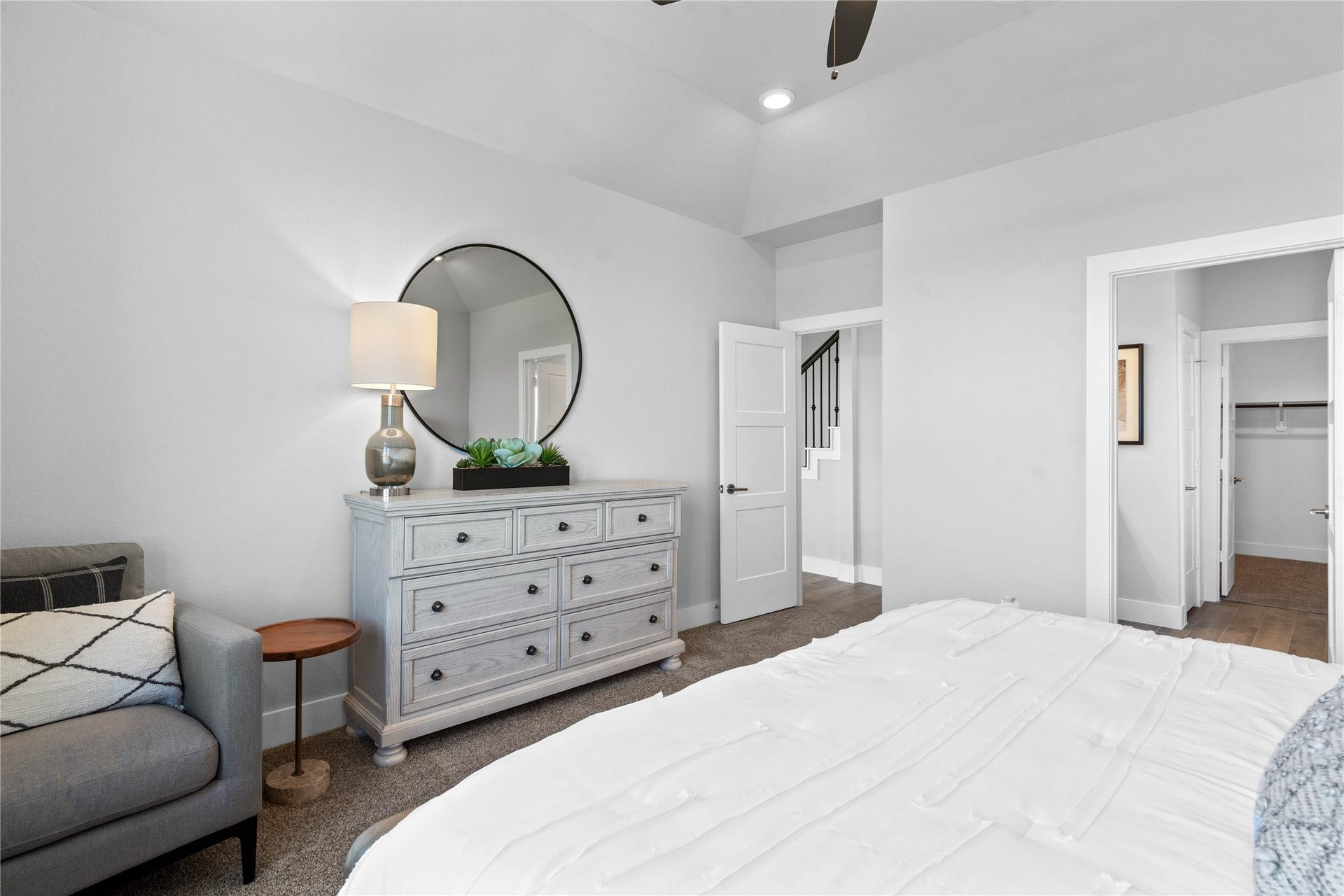 19608 Montgomery Ridge Way, Montgomery, TX 77316 The private primary suite efficiently connects the sleeping area with the dedicated bathroom and generous closet.