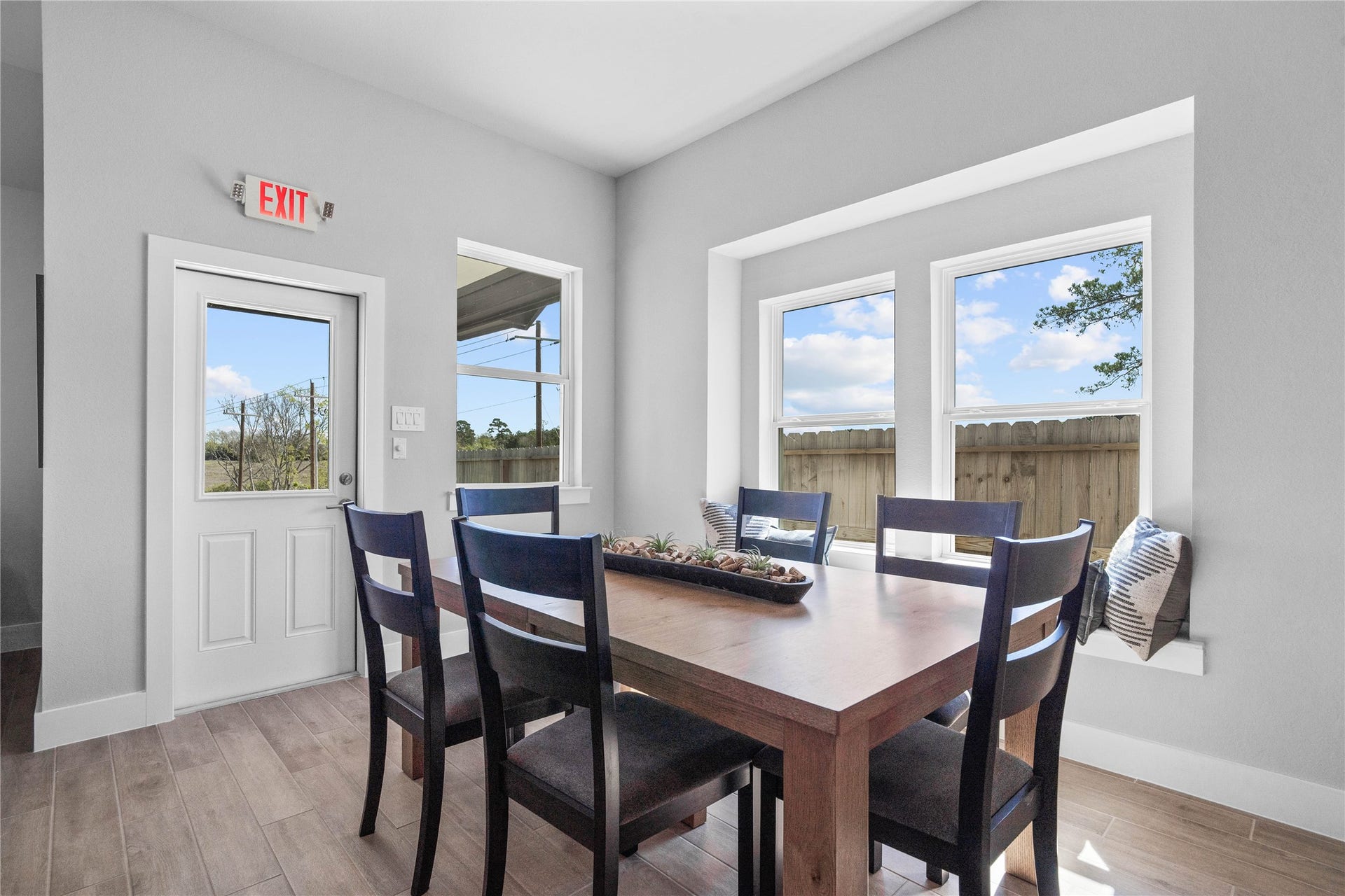 19608 Montgomery Ridge Way, Montgomery, TX 77316 Enjoy meals in this sun-drenched space, featuring durable tile flooring, abundant natural light from the large windows, window seat, recessed lighting, and an access door to the back covered patio.