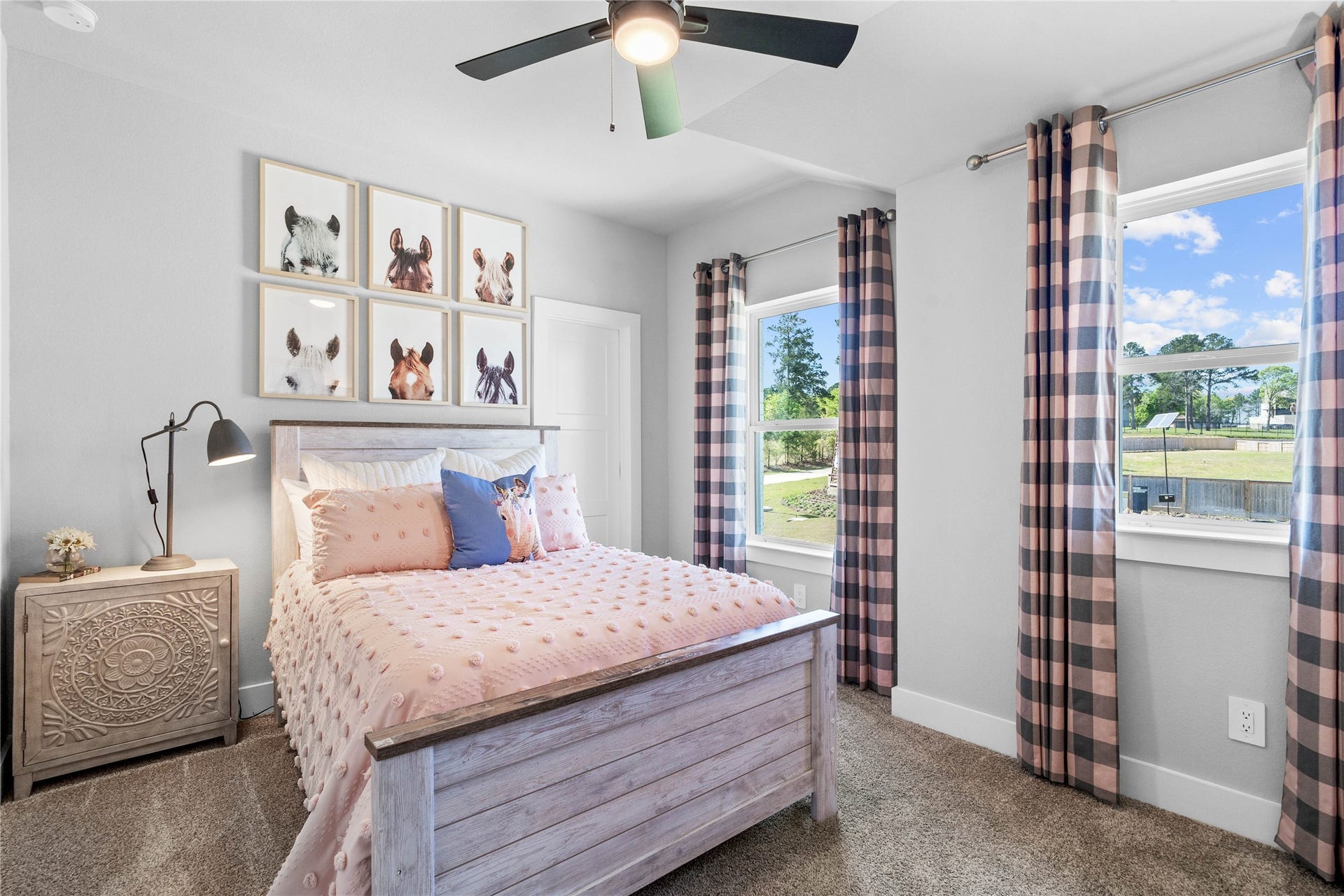 19608 Montgomery Ridge Way, Montgomery, TX 77316 This room features soft plush carpeting, a window with fitted blinds, sloped ceiling, and a walk-in closet.
