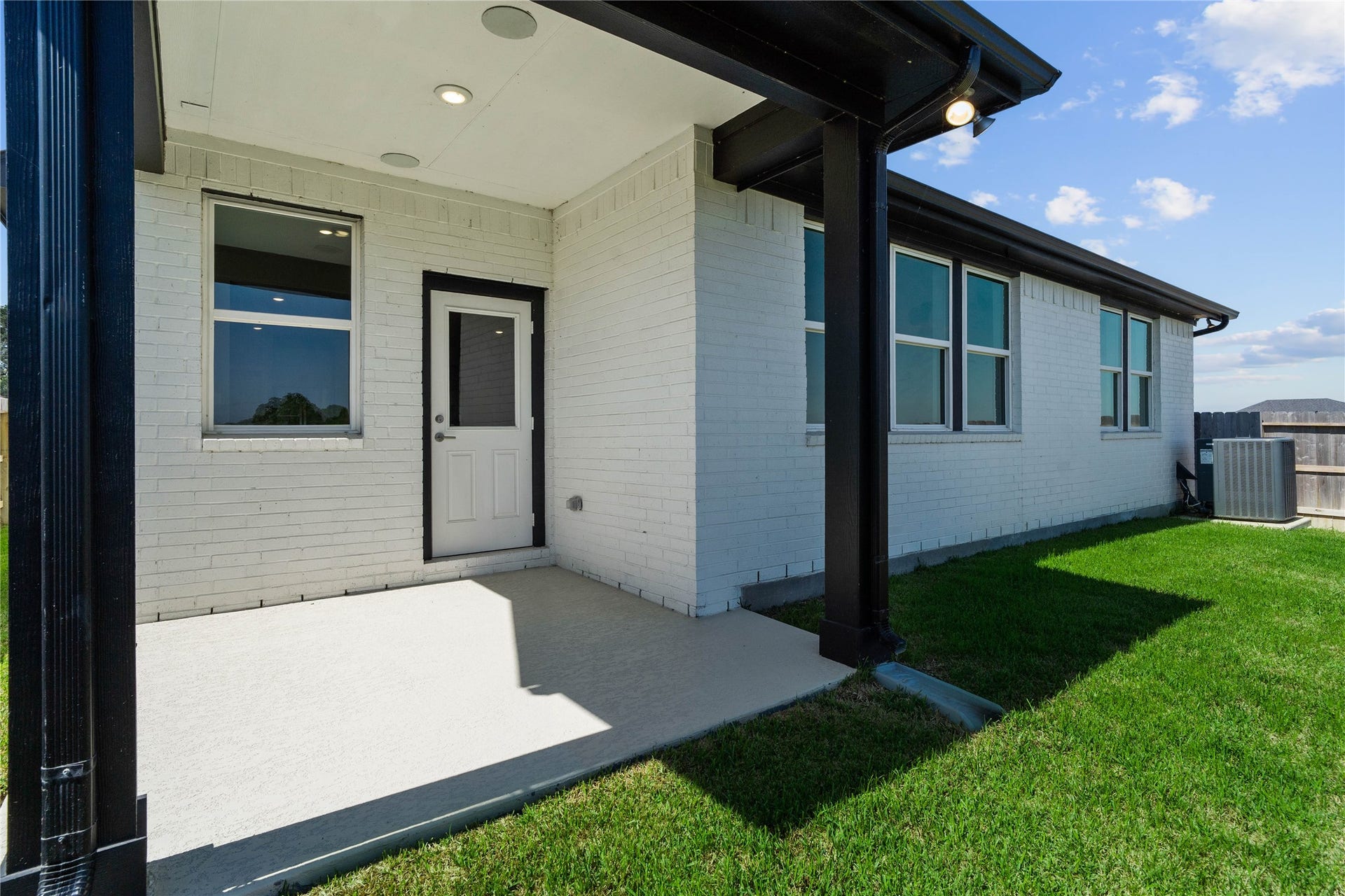 19608 Montgomery Ridge Way, Montgomery, TX 77316 The spacious covered patio offers a tranquil outdoor retreat, perfectly designed for savoring your quiet morning coffee or unwinding during peaceful evening relaxation.