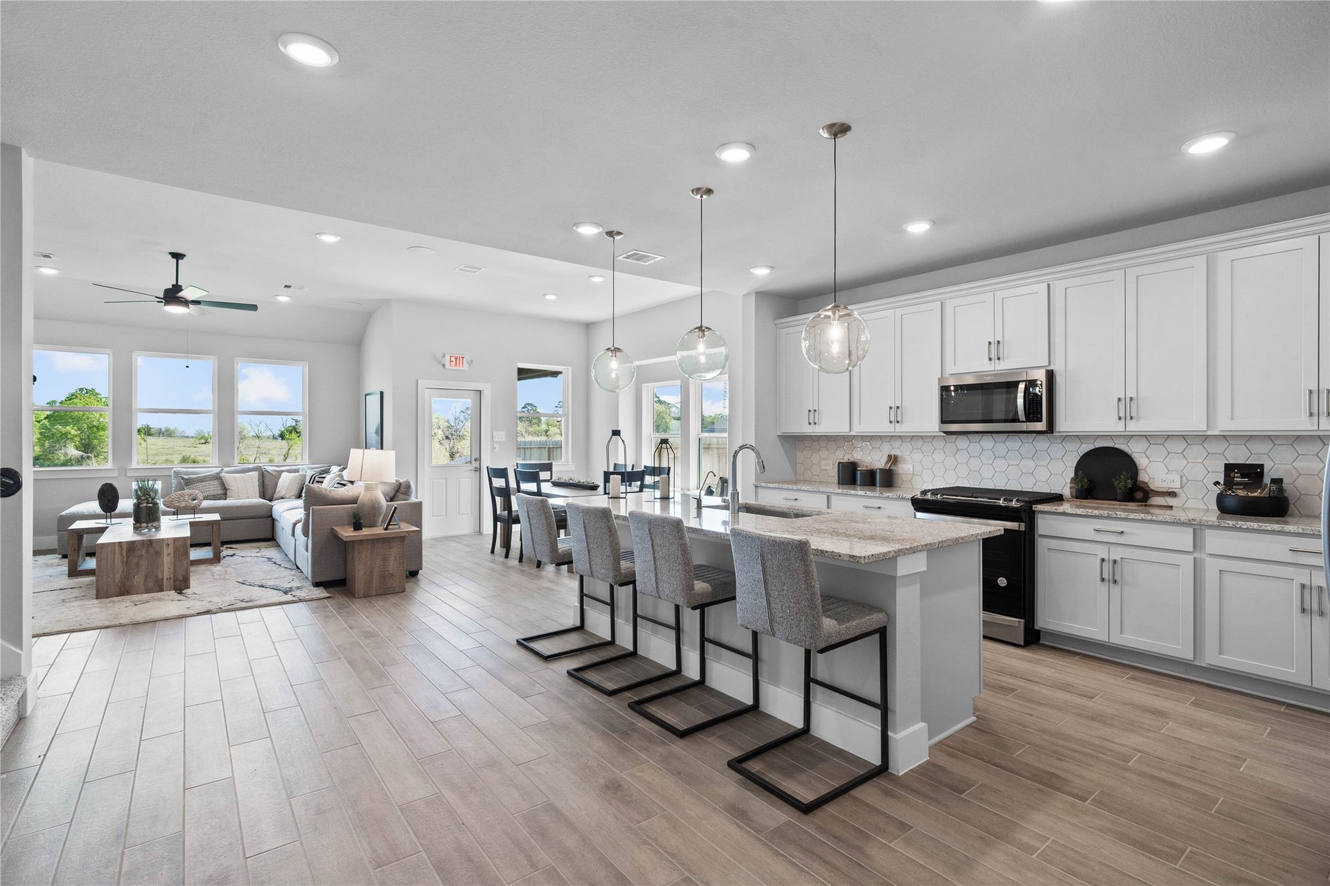 19608 Montgomery Ridge Way, Montgomery, TX 77316 Enjoy seamless sightlines across the open-concept kitchen, dining and living areas, making entertaining a breeze and ensuring you're never far from the conversation.