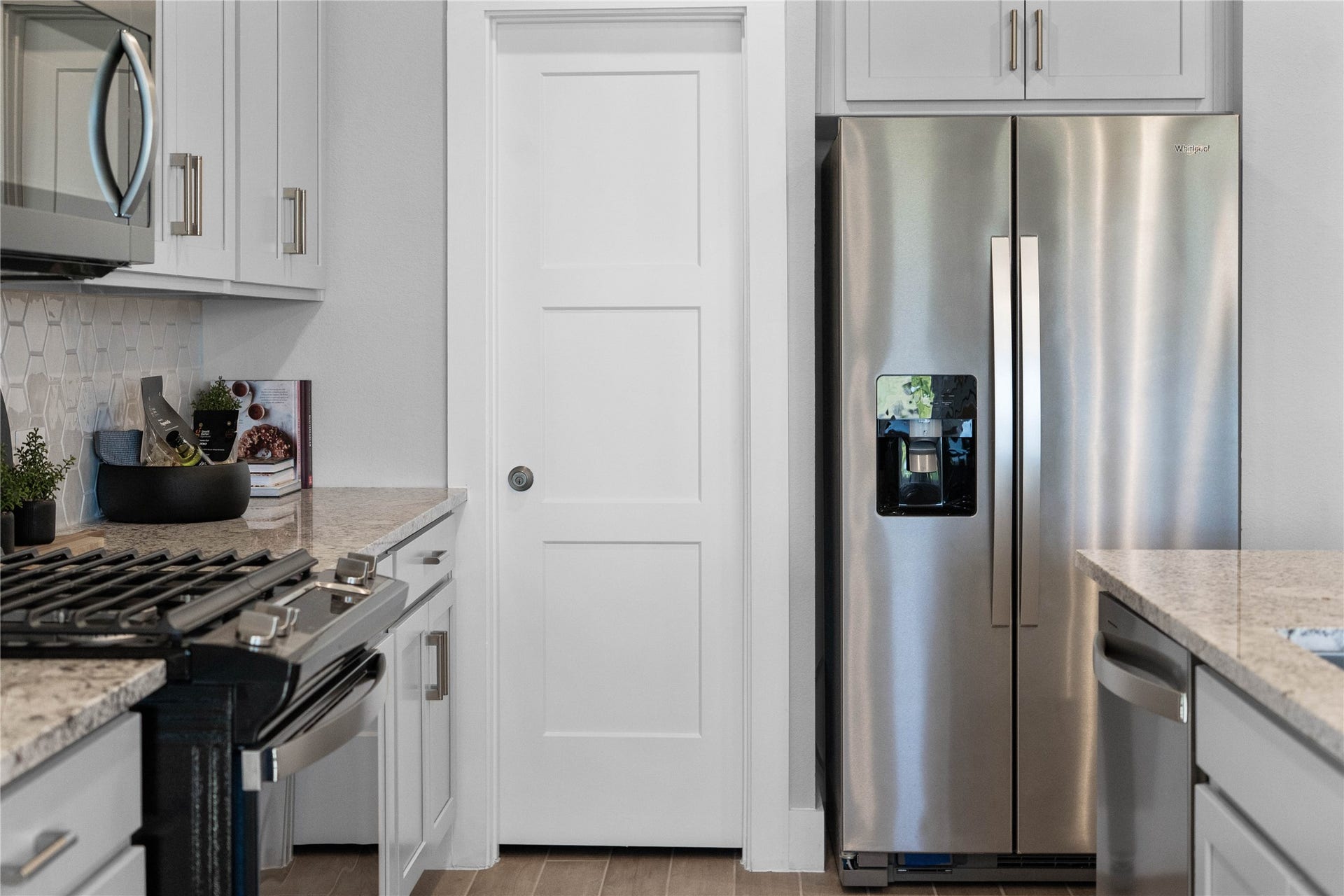 19608 Montgomery Ridge Way, Montgomery, TX 77316 Kitchen comes equipped with a side-by-side Whirlpool refrigerator.