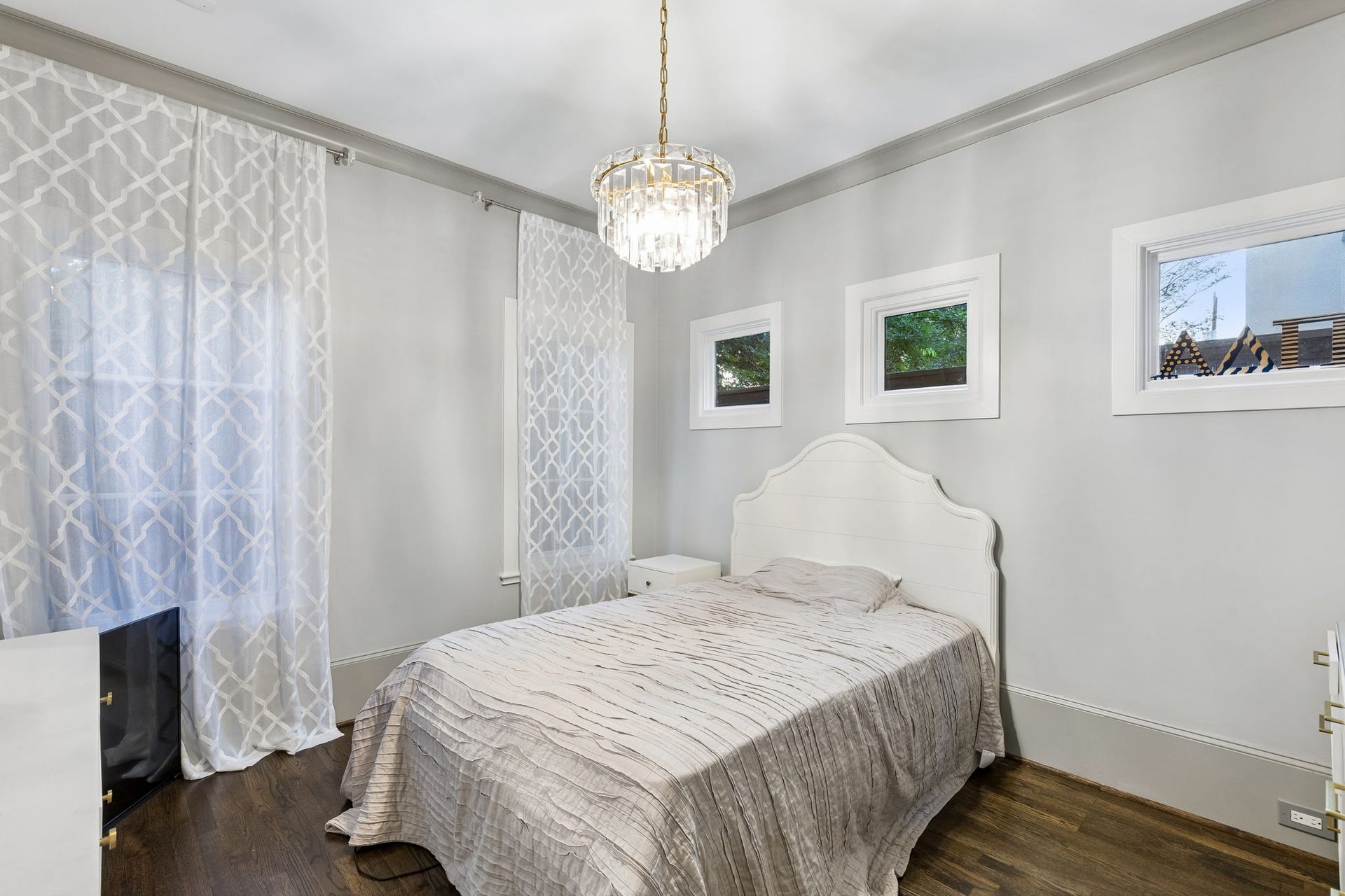 Measuring approximately 10'11" x 12'4", this 1st floor secondary bedroom offers comfort and versatility for guests or family members.