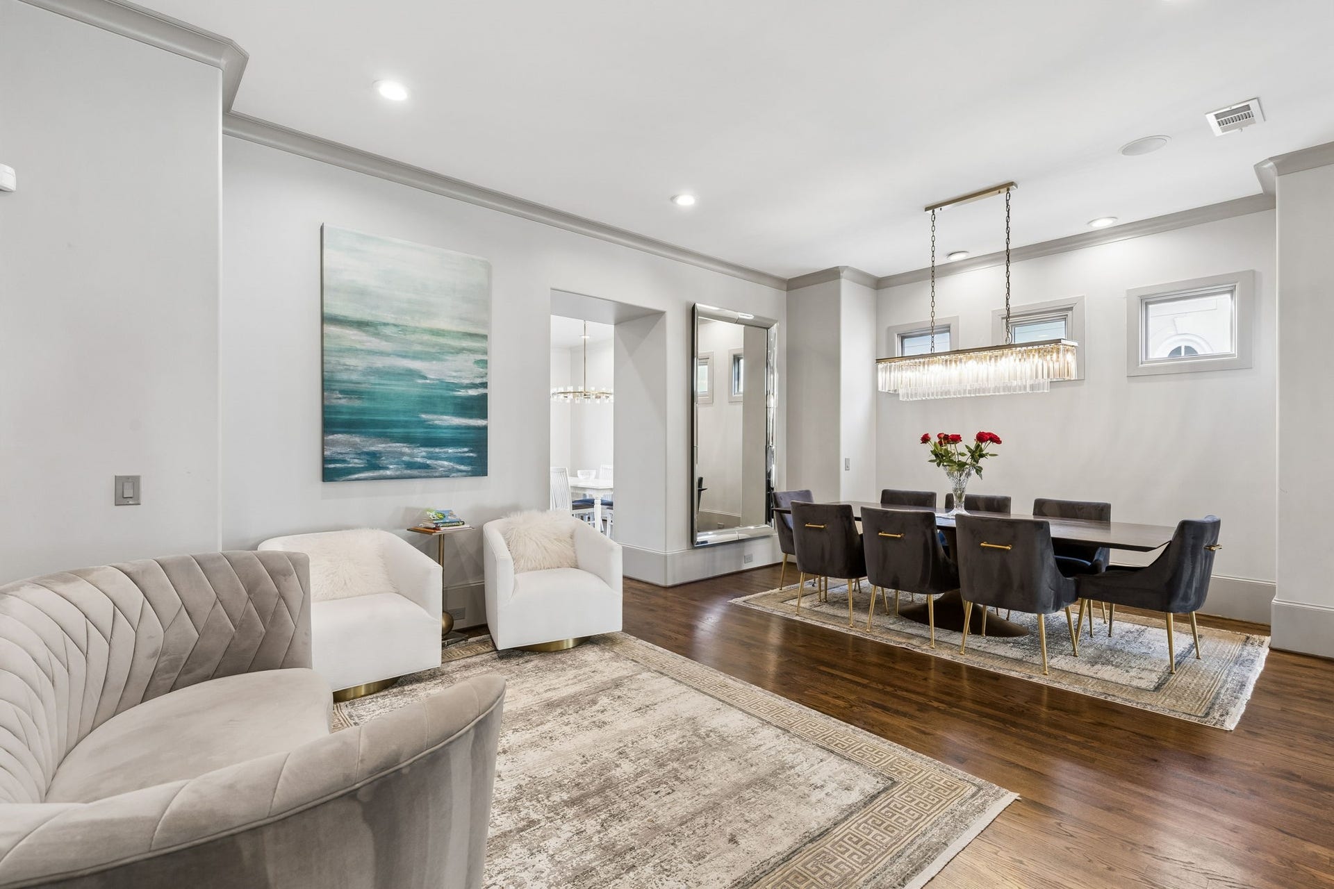 Adjacent to the dining area, a beautiful sitting area creates the perfect setting for pre-dinner cocktails, after-dinner conversation, or quiet moments, adding warmth and sophistication to the space.