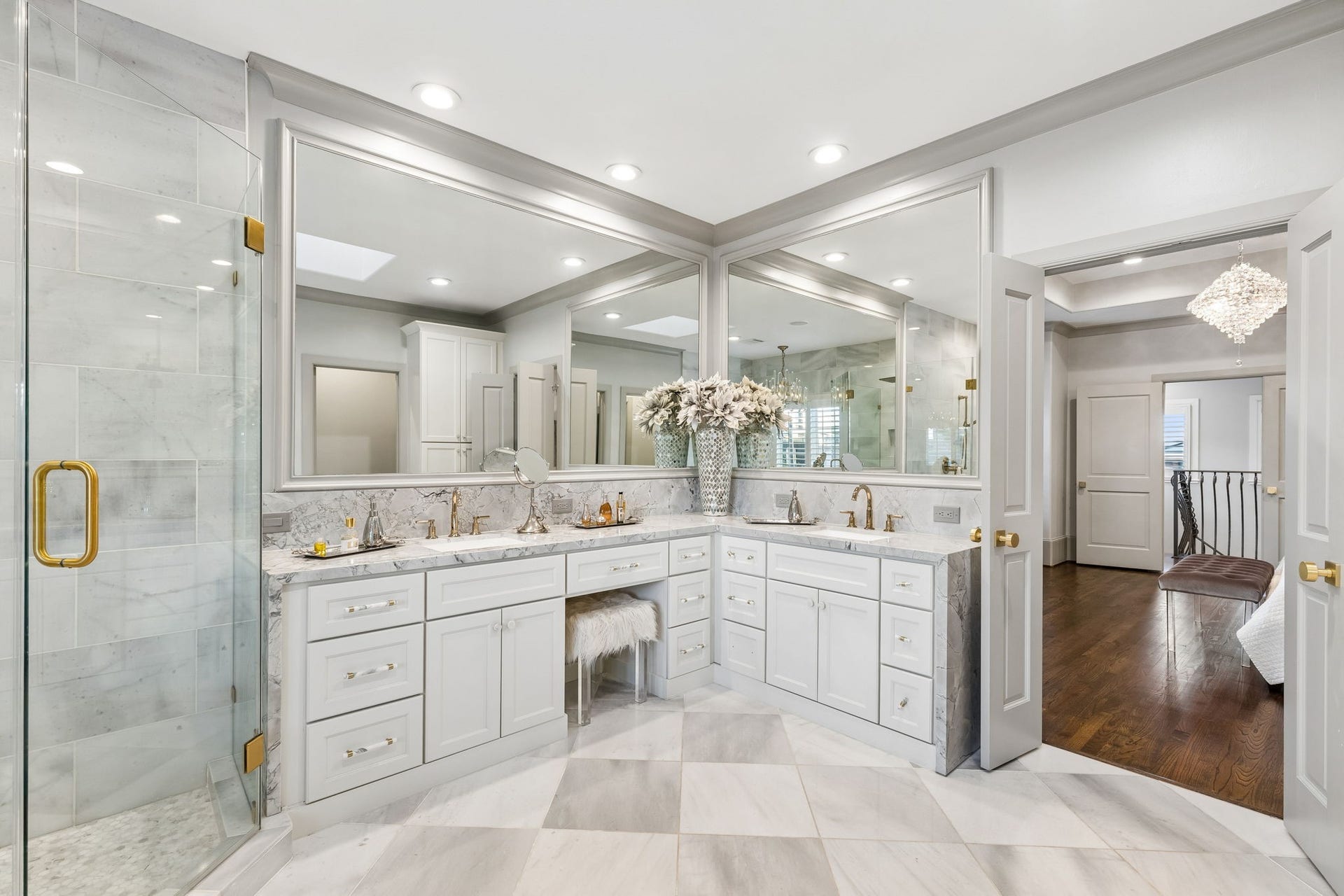 The fully renovated primary bath measures approximately 10'11" x 14'4" and showcases exceptional attention to detail including having a 27x82 laundry closet with stacked washer and dryer.