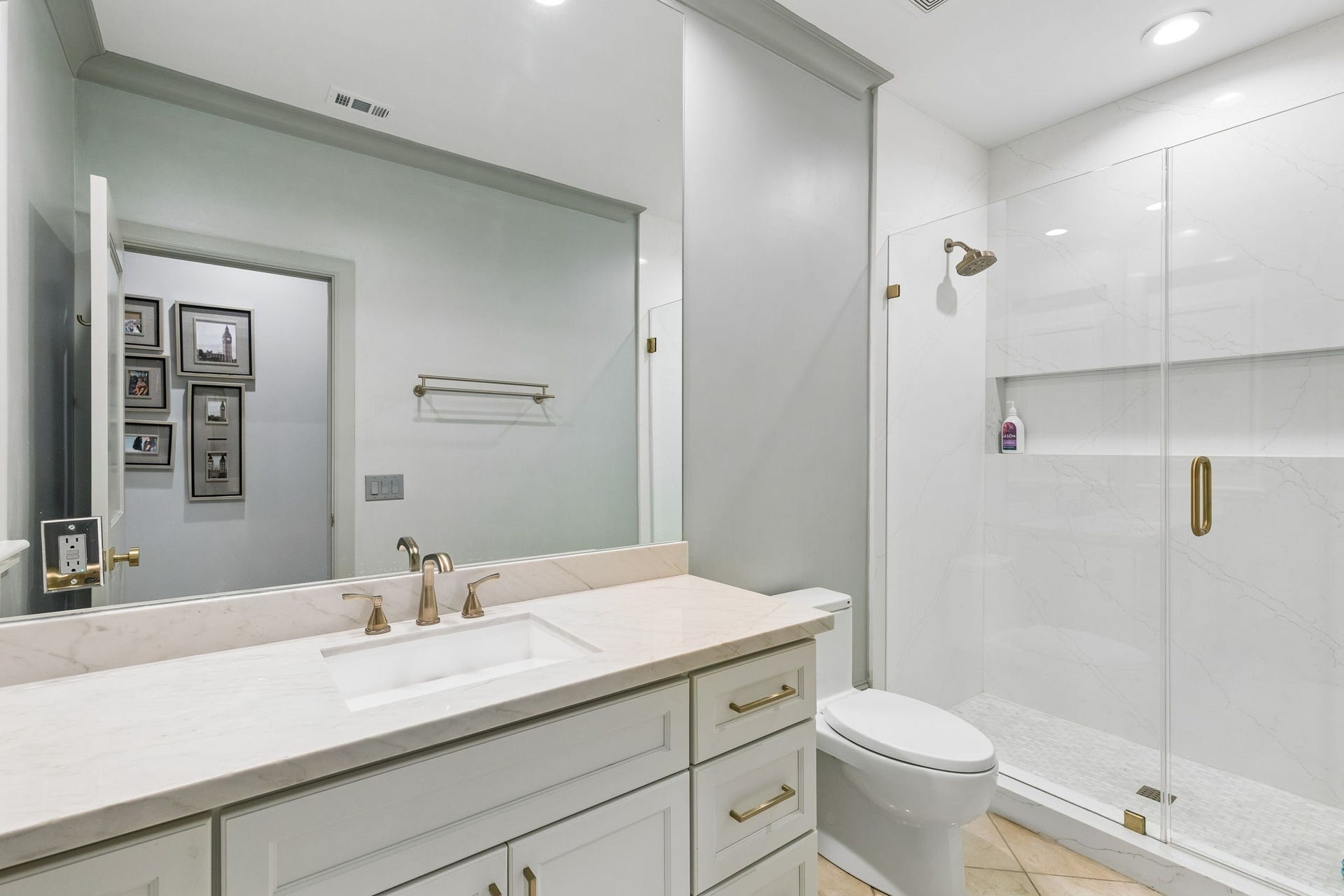 Each secondary bedroom enjoys convenient access to its own dedicated full bathroom, offering privacy for family members and guests. Measuring approximately 5'6" x 11'11", this bathroom offers generous space and thoughtful design and features the same elegant finishes as the other secondary bathroom.