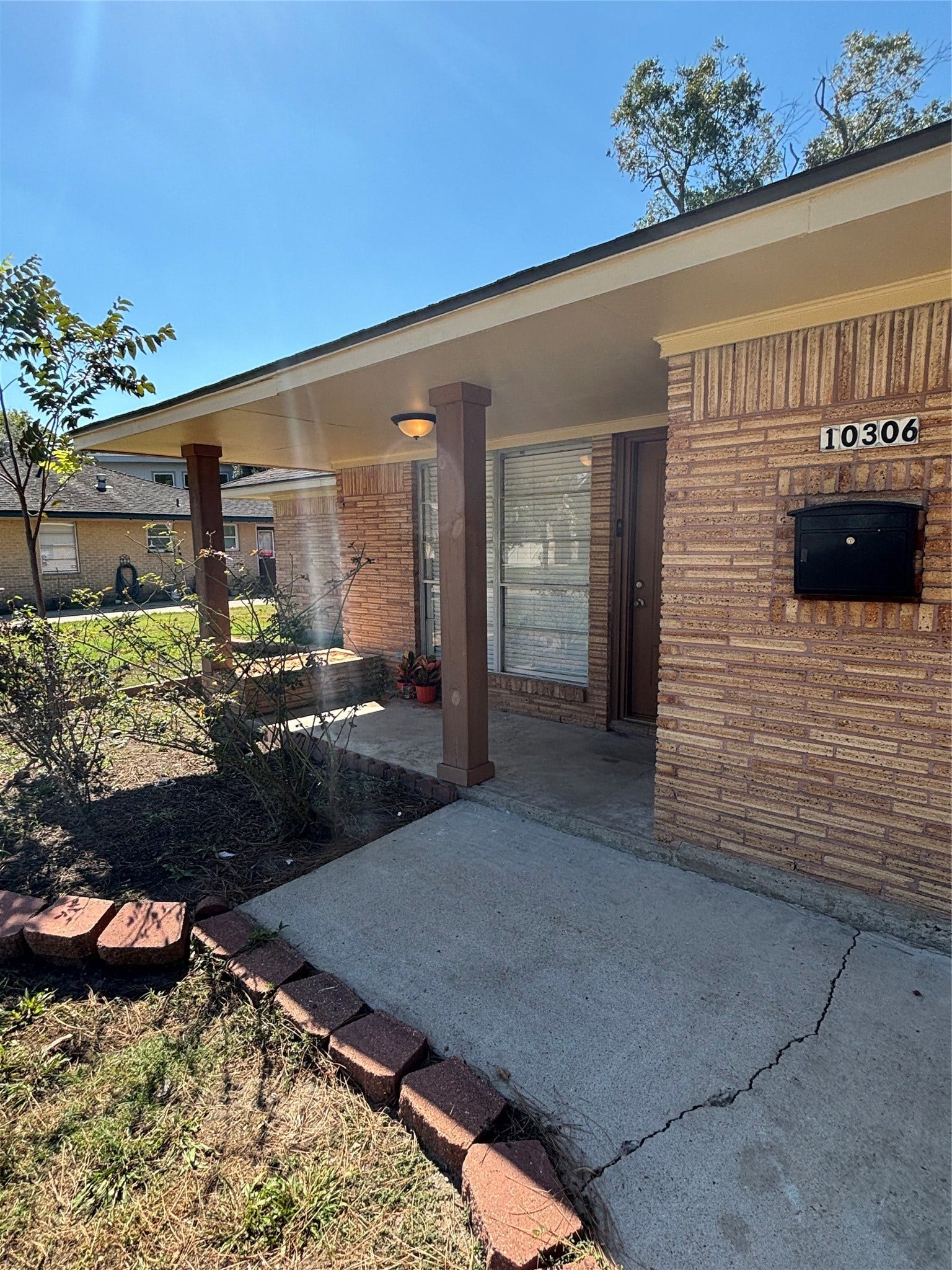 10306 Oboe Drive, Houston, TX 77025 cozy front porch for coffee