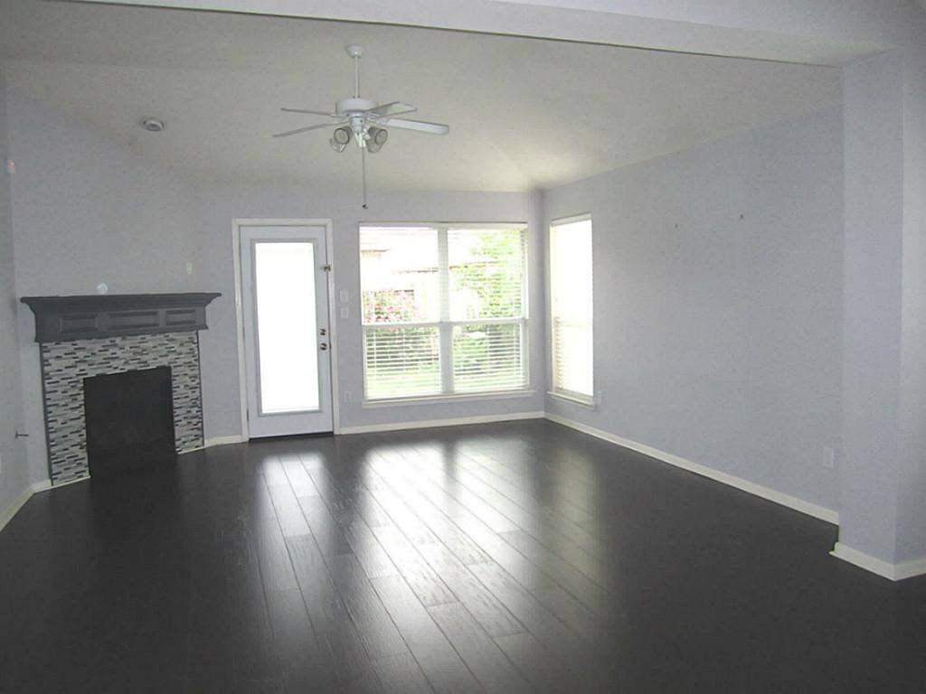 1011 Cove Crest Trail Trail, Fresno, TX 77545 Family room with vaulted ceiling and beautiful gas log fireplace