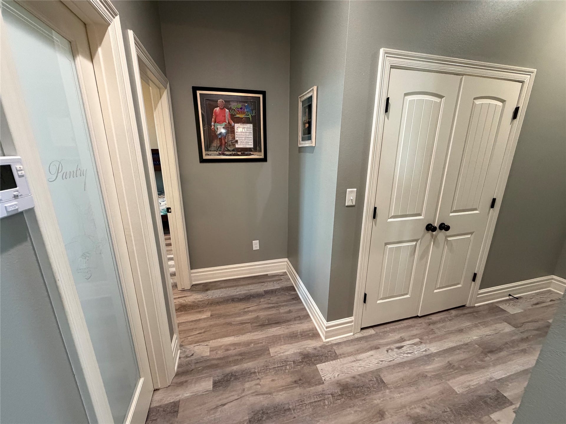715 Magnolia Lane, Port Bolivar, TX 77650 Hallway with pantry on the left and laundry closet on the right